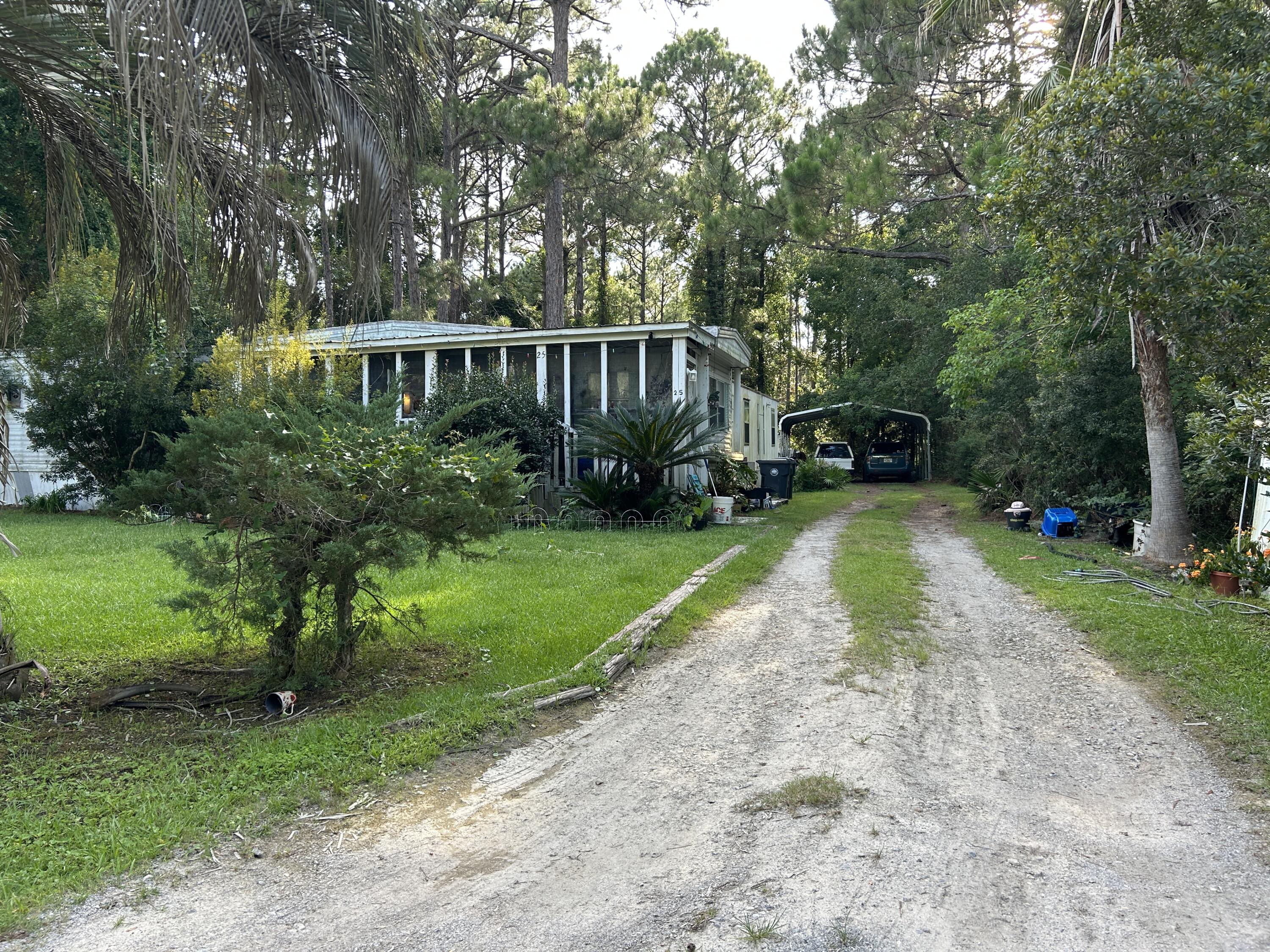 Prime Location in Santa Rosa Beach! This approx. 0.29-acre lot is just 5 minutes from both the nearest public beach access and Hogtown Bayou boat launch--perfect for beach days or days on the water. The property includes functioning well and septic and power is connected. City water and sewer is available (tap fee required). A usable carport is already in place for your car or boat, and no HOA means more freedom and fewer restrictions. Two mobile homes currently sit on the lot with no assigned value--they may be salvageable with time and effort, but the property is priced at land value minus estimated removal costs. AS-IS only! Seller will not make repairs or remove the mobile homes. Bring your vision and call your favorite Realtor today for a tour!