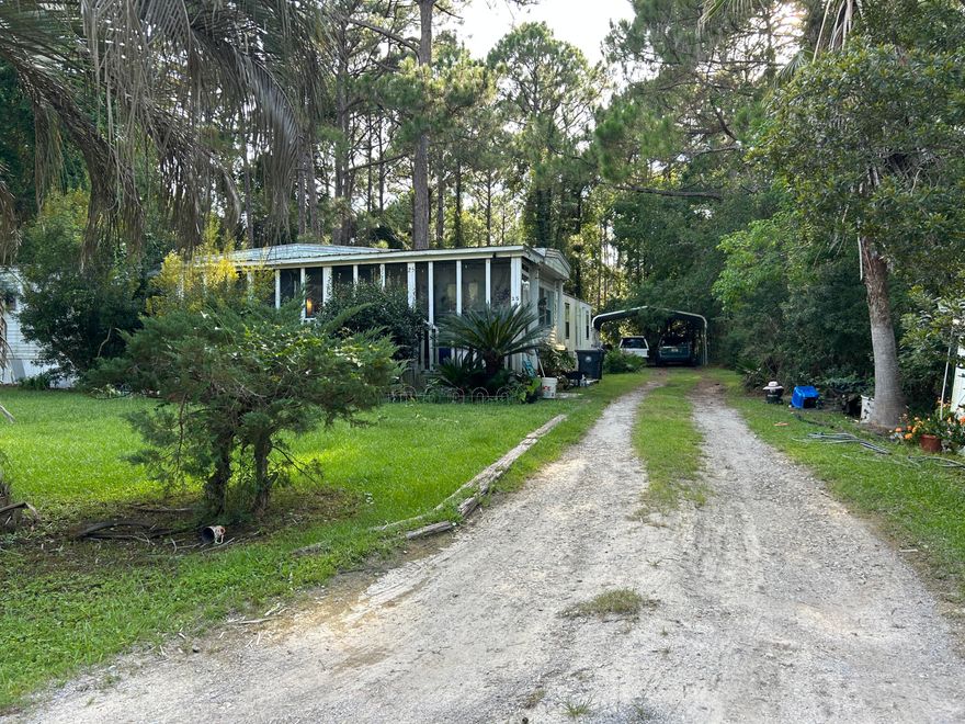 Prime Location in Santa Rosa Beach! This approx. 0.29-acre lot is just 5 minutes from both the nearest public beach access and Cessna Landing boat launch--perfect for beach days or days on the water. The property includes functioning well and septic and power is connected. City water and sewer is available (tap fee required). A usable carport is already in place for your car or boat, and no HOA means more freedom and fewer restrictions. Two conjoining mobile homes currently sit on the lot with no assigned value - they appear to not be salvageable and the property is priced at land value minus estimated removal costs. AS-IS only! Seller will not make repairs or remove the mobile homes and it is priced accordingly. Bring your vision and call your favorite Realtor today for a tour!