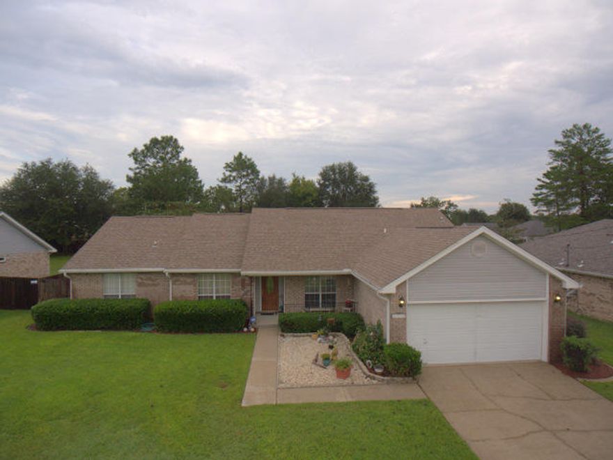 Beautiful upgraded home with 30,000 gallon in ground pool and outdoor kitchen/cabana area. Inside, there is a custom kitchen with solid wood cabinetry, granite counter tops, tiled floors and back splash, pantry and stainless steel appliances. There are 4 bedrooms in a split bedroom floor plan, vaulted ceilings, upgraded plumbing and lighting fixtures, wood burning fireplace, bamboo floors, plant shelves and many custom features. The 3 additional bedrooms have brand new carpeting. Outside, there is an amazing set up with a massive in ground swimming pool and an outdoor kitchen/cabana area. There is a stainless grill & rotisserie, lighting, cabinetry and shaded for great parties. There is an in ground sprinkler system, 16x10 work shop with power, 2014 roof & gutters, 2014 HVAC system & more