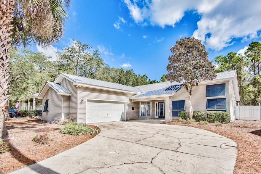Rare opportunity to own a phenomenal 3 bedroom, 2.5 bath home on a generous lot totaling 1/4 acre just off of beautiful Scenic 30A in Seacrest. Enjoy the added privacy a larger lot can provide along with a fantastic screened-in pool and paver deck. There are no HOA fees and the Seacrest Drive public beach access is located just at the end of the street within half a mile from the home! This incredible  one level home has over $100,000 in updates and is beautifully furnished & decorated to impress! There are beautiful architectural lines and vaulted ceilings extending to nearly 16 feet, allowing the home to feel very spacious. There is abundant natural light throughout with the large windows. The home has been well-maintained & would make an amazing vacation home or primary residence! The interior features an open floor plan with luxury vinyl flooring throughout with tile in the bedrooms & bathrooms. Notable updates include new lighting fixtures throughout, Quartz countertops in the kitchen and bathrooms, shiplap above the wood burning fireplace mantle and underneath breakfast bar, added wetbar, fully renovated bathrooms with LED mirrors, custom tiled showers and new vanities, brand new cabinets, new plumbing fixtures, and barn doors to name a few. The home is nice and bright with several large windows allowing plenty of natural light in. This home offers a uniqueness that allows this home to stand apart. The kitchen was renovated to have more of an open concept and features a great breakfast bar, Quartz countertops, recessed lighting, and stainless steel appliances. Just off the kitchen is the grand open dining area with amazing raised ceilings & chandelier and a sliding glass door that leads out to the screened-in patio and pool area. The back patio is perfect for outdoor entertainment such as grilling, dining, and swimming. With a serene, fully fenced backyard and no homes towering over you, this kind of privacy is hard to find. 

Just off the kitchen is the laundry room offering a full size washer & dryer and storage, a pantry and half bath that is convenient for guests. You can also access the 2-car garage from this area. The half bath is charming with reclaimed wood, shiplap, and Quartz. The spacious master bedroom features a king size bed, flat screen TV, lovely pool views, and a barn door leading into the master bath. The master bath has been updated with a beautiful tiled walk-in shower with mosaic detail, double vanity with Quartz countertop, LED mirrors, and custom backsplash. Both additional bedrooms are generous in size and feature barn doors. The guest bedroom on the front of the home has plentiful windows and natural light and vaulted ceilings. The additional guest bedroom has a double bunk bed but is a "true" bedroom with a closet and could even be a great office. The shared guest bathroom features a shower/tub combo with unique tile surround and an LED mirror as well. This home offers ample parking with a two car garage and a large driveway with parking for 4. There is nice landscaping for great curb appeal, a covered porch at the entry, a metal roof for that classic Florida cottage aesthetic, and even the mailbox matches the style! 

This home is a prime value for this community as there is a lot of new construction on the same street. You have a laid back, no HOA community, a great beach right down the street and you are still close to many entertainment, shopping & dining options. Neighboring communities include iconic Rosemary Beach, Alys Beach and Seacrest Beach. Peruse along the greens and even enjoy seasonal Farmer's Markets at Rosemary Beach and Gulf views at Havana Grill and Pescado. Alys Beach is nearby as well with stunning white architecture and great entertainment & dining options like Neat cocktail lounge, Raw & Juicy, George's & Caliza to name a few! Plus you have The Merchants at Seacrest Beach and The HUB where you can even catch live music and the game. There are endless options right outside your door - you can enjoy the perks of beach living yet escape to your expansive lot with peace and serenity. This one won't last long!