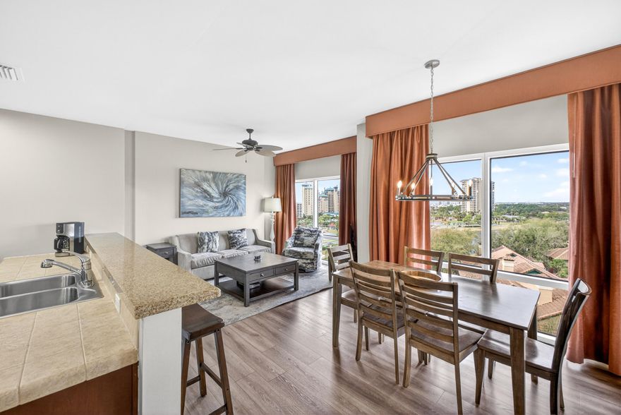 Newly updated and beautifully appointed, this west-facing 7th-floor residence showcases breathtaking views and unforgettable sunsets from its expansive wraparound balcony. Recent upgrades include a new HVAC system, newly installed washer and dryer, new mattresses and bed frames, updated flooring throughout, fresh paint, stylish furnishings, and luxury vinyl plank flooring. This spacious 2-bedroom, 21/2-bath lockout layout offers exceptional flexibility and rental potential. The main residence features a king suite and queen sleeper sofa, while the private lockout includes a king bed and sleeper sofa--ideal for maximizing occupancy. Each side is equipped with its own dedicated HVAC system and water heater, and the main condo includes an in-unit washer and dryer for added convenience. Additional highlights include owner storage within the building that transfers with the sale. Residents and guests of Luau at Sandestin Golf and Beach Resort enjoy premium amenities such as elevators, covered parking, a barbecue area, a large tropical pool with heated spa, fitness center, and a stunning top-floor observation deck.

With its desirable lockout configuration and resort-style amenities, this property offers an outstanding opportunity to maximize rental income while enjoying the best of coastal living.

As an introduction to the Sandestin lifestyle, we invite our new owners to explore amenities that make Sandestin special. The listing brokerage and seller(s) are presenting the buyer(s) of this property with (2) 90-minute rounds of Tennis court time, a golf foursome at one of our three championship courses, and a round of golf for up to four (4) players at the unrivaled Burnt Pine Golf Club.
Sandestin Golf and Beach Resort features more than seven miles of beaches and pristine bay front, four championship golf courses, 15 world-class tennis courts, a 226-slip marina, a fitness center, spa and celebrity chef dining. Shop, dine and play at the charming pedestrian village, The Village of Baytowne Wharf and more. Inside the gates of the resort, residents enjoy a balanced lifestyle of high-class living, spanning the 2,400 acres from the beach to the bay. Everything within the gates of the resort is accessible by golf cart or bicycle. The entire resort is interconnected by miles of pedestrian, bike and golf cart paths that weave through groves of live oaks, meandering past natural lagoons, fountains, man-made lakes, and meticulously landscaped fairways.