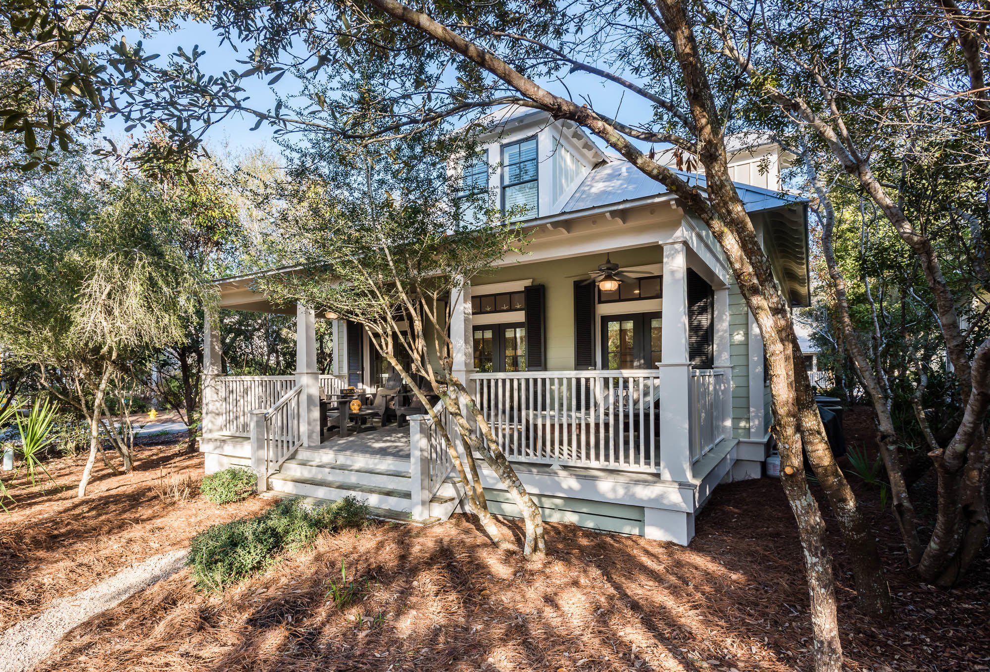 This 4 bed 3 bath Florida Beach cottage located in the Tennis District of Phase 1 of Watercolor offers convenience and charm! Enjoy your morning coffee on one of the expansive porches before heading to the white sandy beaches of the Gulf of Mexico to soak up some sun. The coveted first floor master bedroom has access to the porch and an ensuite. The galley style kitchen is equipped with stainless steel appliances and over looks the spacious open living/dining area. An additional bedroom with ensuite bathroom completes the first floor. The second floor of the home offers an additional bedroom and also a bunk room that the kids will love for sure. A third full bathroom finishes up the 2nd floor. The home offers custom bamboo blinds, transom windows, hard wood floors and shiplap