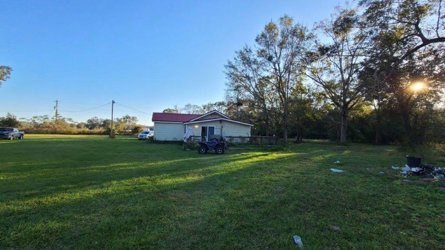 Country Living Awaits! 2 bedroom 1 bath house on almost 3 acres of land in a quiet and peaceful area in Baker FL just 15 minutes away from Crestview! House will need some TLC, mostly cosmetic updating and new floors. It was renovated and brought up to code about 3-4 years ago when it had a brand new AC, hot water, and wood deck was redone back then as well. Metal roof was put in 2004.Property features a large workshop/storage unit out the back complete with power and partial ac and insulation. There's a hay barn on the property as well, perfect for horse owners.