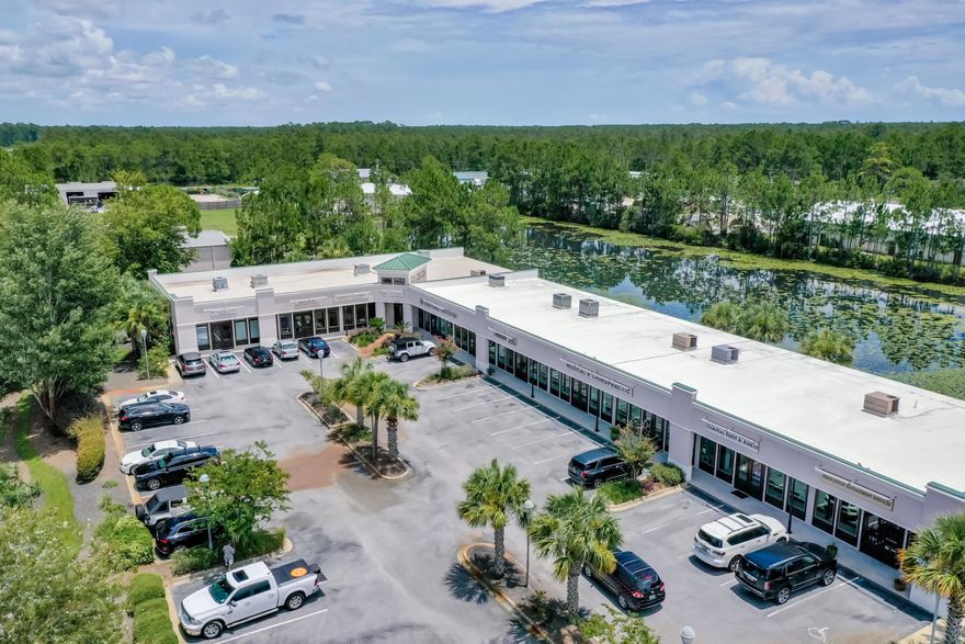 A highly visible professional office and retail plaza in the rapidly expanding market of Santa Rosa Beach! This space is one of the best locations within the Waterside Business Center, adjacent to the popular Tortoise Clinic, which will generate a great draw in addition to the other great tenant mix. The space yields 10' ceilings, 8' double door entry, large storefront windows, premium level of interior finish, ceramic tile entry, tiled restrooms, rear door leading to a scenic nature walk around a lake, lush landscaping, thoroughly maintained grounds and common areas, desirable ingress/egress, and high exposure to the 40,000+ daily traffic count passing by on Highway 98!