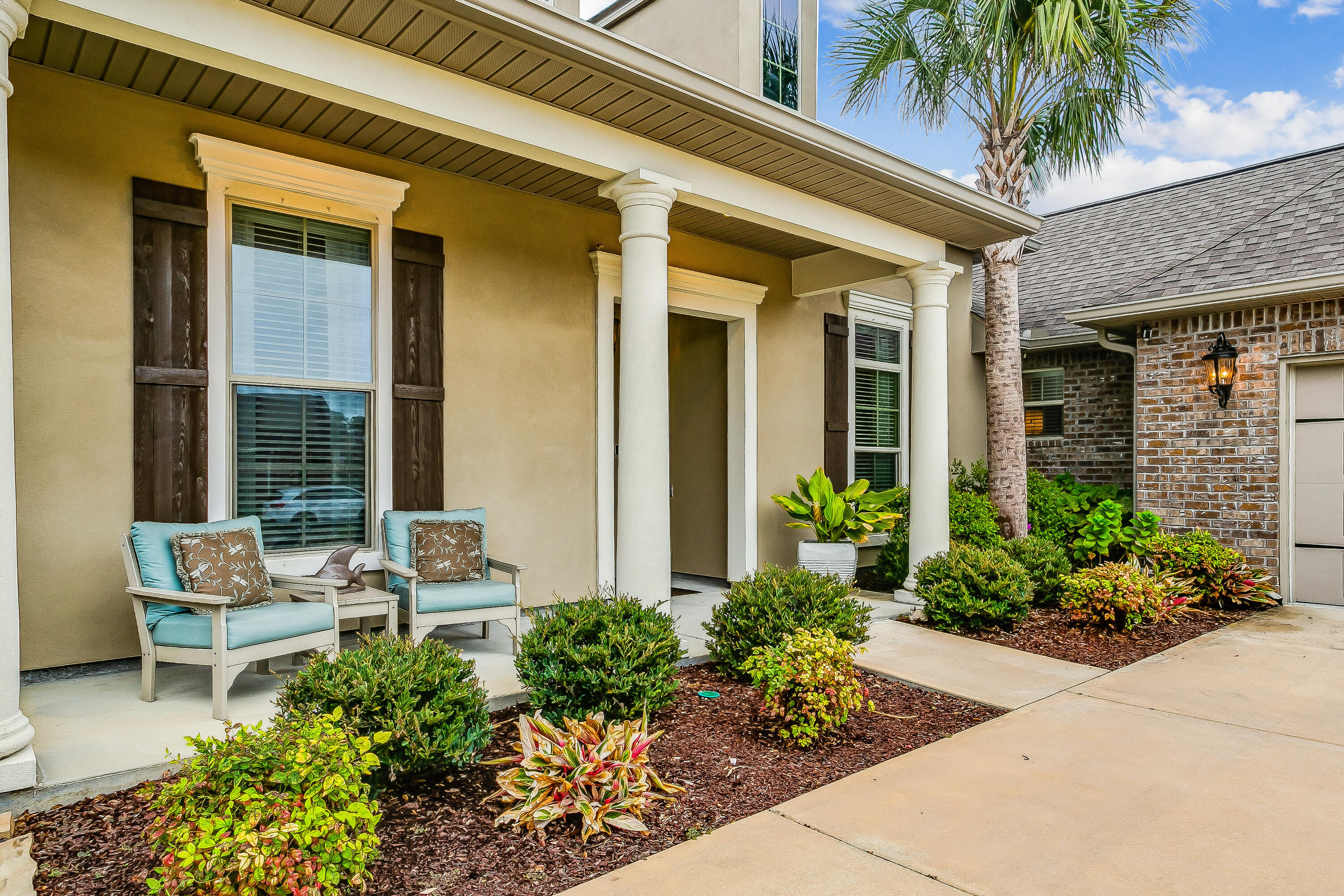 Stunning French Arcadian style 4 bedroom 3 bathroom home in The Waters community in Gulf Breeze. This home has the highest elevation in the neighborhood and boasts several luxury upgrades throughout. Framed doorways, updated light fixtures, crown molding, hardwood and custom tile throughout. Wainscoting added to the Dining Room. Kitchen updated with Wolf gas cooktop stove, cast iron farm sink, navy soft close cabinets, extended kitchen island with leather granite. Spacious laundry room with added sink. Barn door added to hallway of additional bedrooms. Primary bedroom with large walk in closet. Primary bathroom with double vanities, separate shower, garden tub. Landscaping, storage shed and gunite pool added to create a beautiful and serene outdoor backyard area with a covered patio