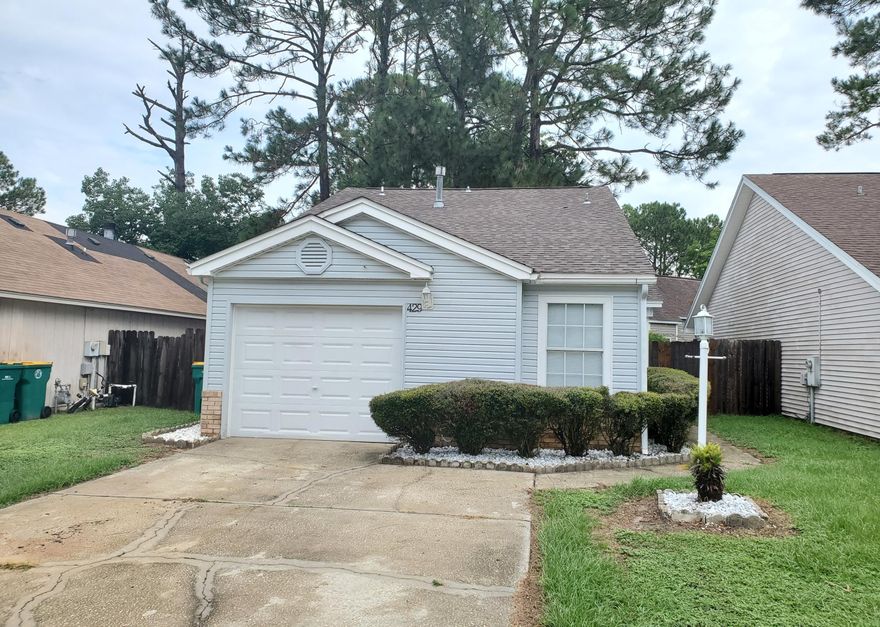 Welcome home! Adorable 3 bedroom 2 bath home for sale in desirable Fort Walton Beach! One car garage. Tile floors in main living space. Carpet in bedrooms. Great living/dining combo with pass-through kitchen. Extra tall ceilings! Open deck and fenced in back yard off of the dining room. Split bedroom layout for added privacy. This would make the perfect family home or income property. Vacant and easy to show!
