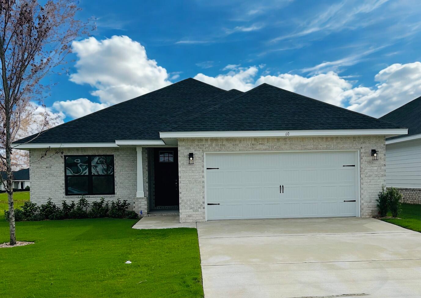 Seller pays the bulk of closing costs w/ preferred lender. Additionally, 4.99% fixed rate financing for FHA/VA financing, with $10K flex money which can be used at buyer's discretion to add features such as blinds, fridge, additional ceiling fans or apply to prepaids, HOA costs etc. etc.Popular Craftsman, open concept, 3 BR/2 BA, full brick home. Spacious master bedroom (14x22), Cathedral ceiling in great room, other rooms 9' high. 8' entry doors, quartz countertops in kitchen + baths, durable Coretec Pro Plus LVP flooring throughout. No carpet. Tray ceiling in master with a large walk in closet, separate tub and shower. Generous covered patio. Fully sodded yard, sprinkler system, well+pump. Garage opener, self-close cabinet doors+drawers. Community pool to be built by developer.