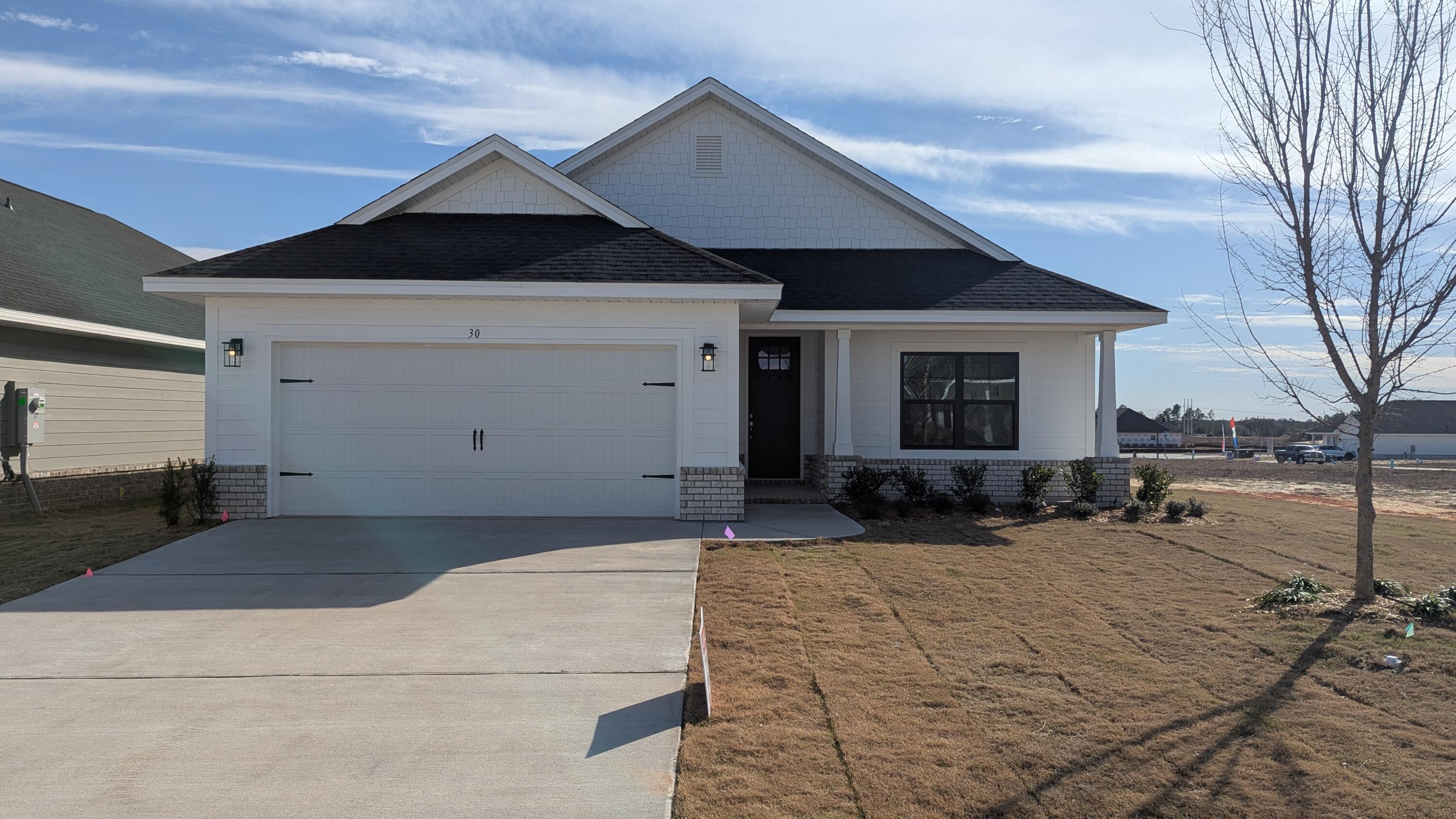 Seller pays the bulk of closing costs w/ preferred lender. Also available $15K flex money which can be used at buyer's discretion to add features such as blinds, fridge, additional ceiling fans or apply to prepaids, HOA costs or other closing costs, etc.Popular Craftsman 3 BR/2 BA, full brick home. Spacious master bedroom (14x22), 9' ceilings throughout, 8' entry doors, quartz countertops in kitchen and baths, durable Coretec Pro Plus LVP flooring throughout. No carpet. Tray ceiling in master with a large walk in closet, separate tub and shower. Generous covered patio. Fully sodded yard, sprinkler system, well+pump. Garage opener, self-close cabinet doors+drawers. Community pool to be built by developer.