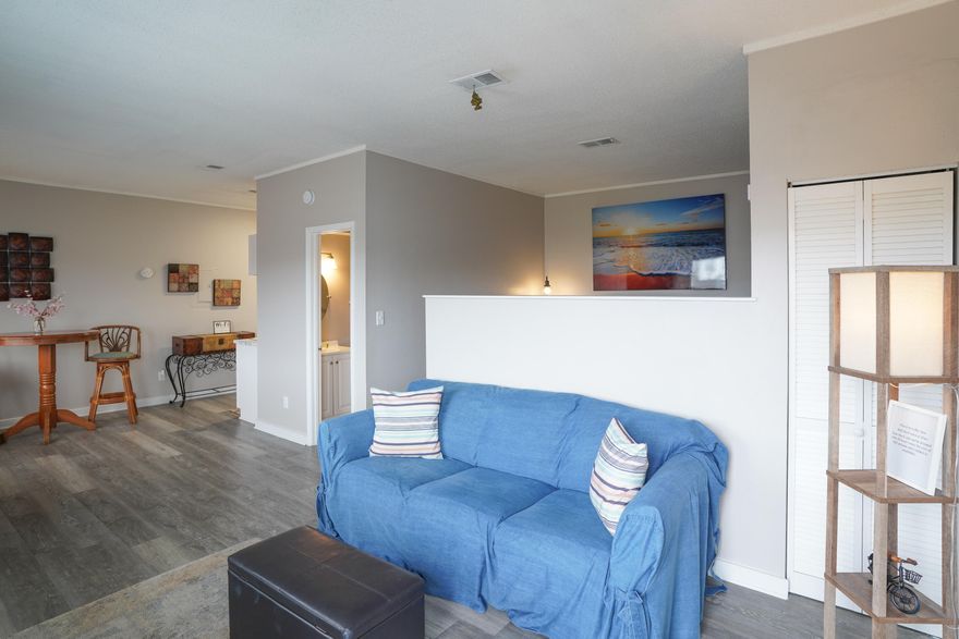 Affordable and Adorable describe this  ISLAND CONDO! This SHORT TERM RENTAL is just a short walk to the Beach! It features LVP flooring, horizontal blinds and a neutral color pallet and is just waiting for your personal touches. This unit generated over $29,000 in revenue, as a short term rental, in 2022! Perfect as a Vacation Get Away, rental or your new home! Fully Furnished and bookings for 2023 are already being made!              (Unit 204 also listed)