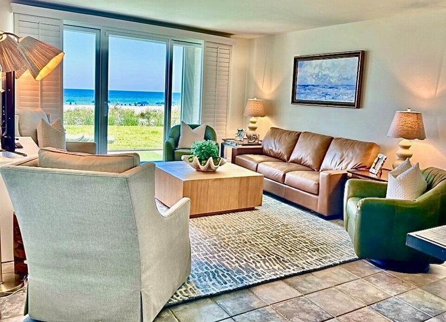 Experience a slice of paradise in this stunning ground floor condo, perfectly positioned in the heart of Destin. From the moment you arrive, you'll be greeted by unobstructed, panoramic Gulf views in the living room, kitchen and primary suite offering front door parking and a short stroll to the community pool and beautiful white sand beaches of the Gulf of America. The kitchen boasts stainless steel appliances, ample granite countertops, a large breakfast bar for casual dining, pantry and full size washer / dryer.  With tile floors throughout, fresh paint, smooth ceilings (no popcorn) and fully furnished with a perfect blend of comfort and style. Step through the sliding glass door to your covered patio where you can enjoy gentle Gulf breezes and the sounds of the surf.