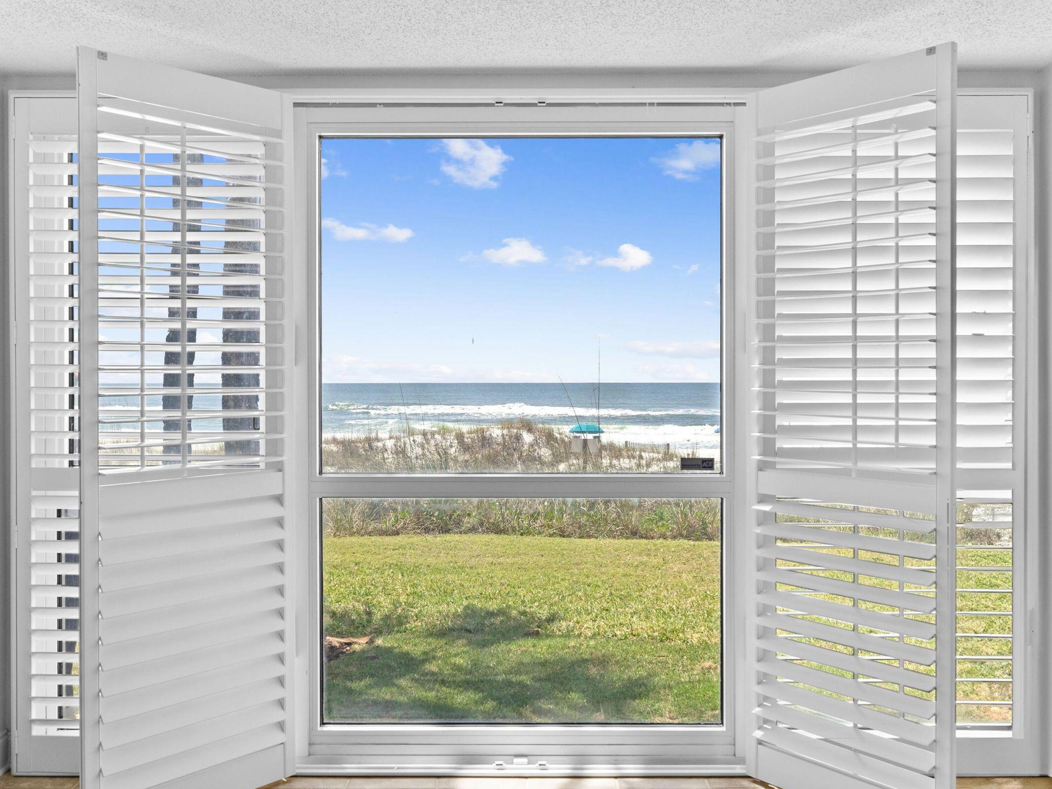 Experience a slice of paradise in this stunning ground floor condo, perfectly positioned in the heart of Destin. From the moment you arrive, you'll be greeted by unobstructed, panoramic Gulf views in the living room, kitchen and primary suite offering front door parking and a short stroll to the community pool and beautiful white sand beaches of the Gulf of America. The kitchen boasts stainless steel appliances, ample granite countertops, a large breakfast bar for casual dining, pantry and full size washer / dryer. With tile floors throughout, fresh paint, smooth ceilings (no popcorn) and fully furnished with a perfect blend of comfort and style. Step through the sliding glass door to your covered patio where you can enjoy gentle Gulf breezes and the sounds of the surf.