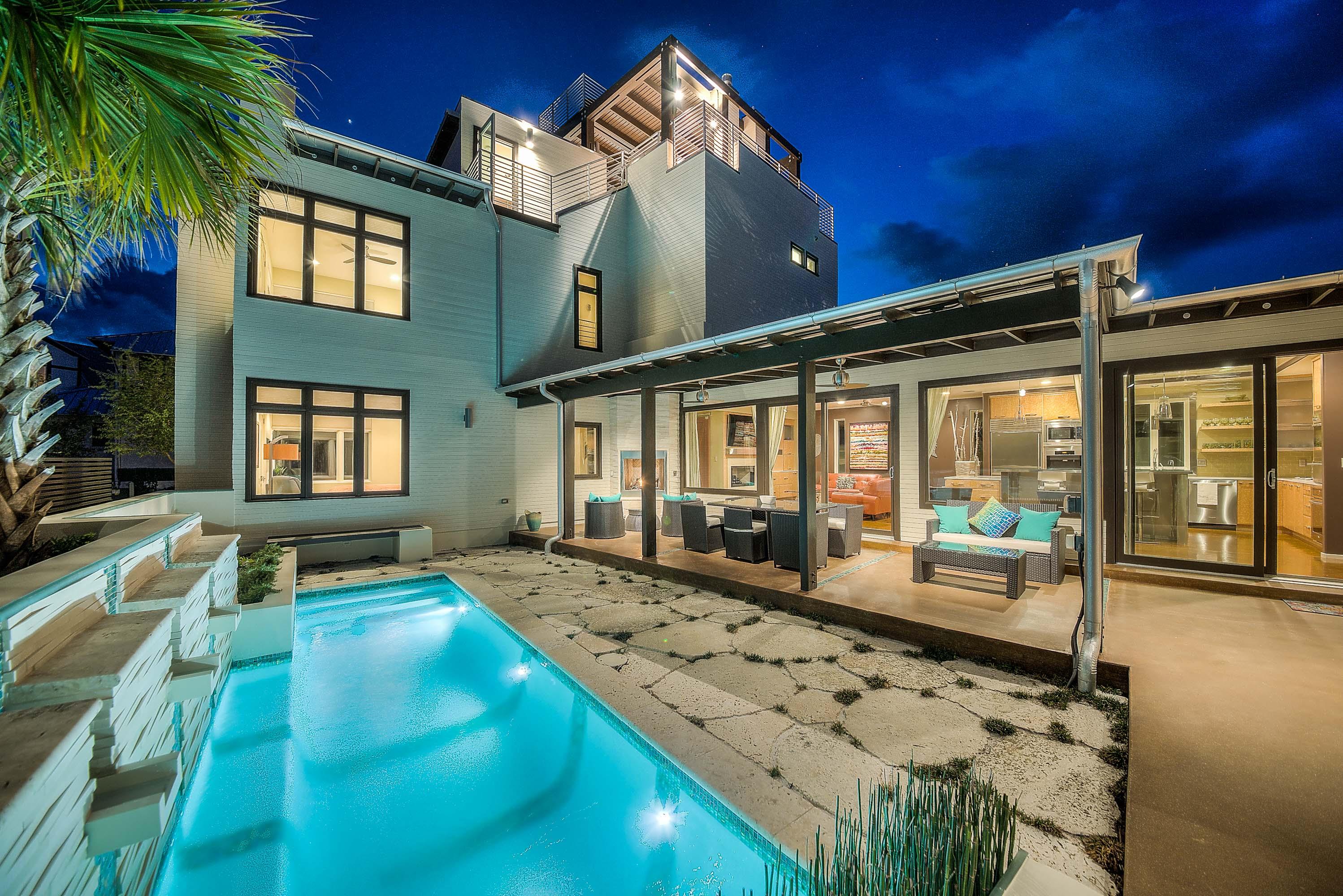 TOTALLY renovated in 2013-14 by MB Construction, this is by far the coolest house in Rosemary Beach. Never been rented & in PERFECT condition, for privacy & style, it just doesn't't get any better than this. While the overall design has a contemporary flair, the overall feel fits in perfectly with the community. The first floor boasts a large open living space based on a beautiful stained concrete floor & anchored by a sleek European style kitchen. A connected dining area sits off to the side; a second living area sits just off to the other side allowing all the living spaces to be connected enough for everyone to be a part of the party but with enough separation to allow kids, teenagers & adults to all have separate spaces. All this opens onto your own private paradise.