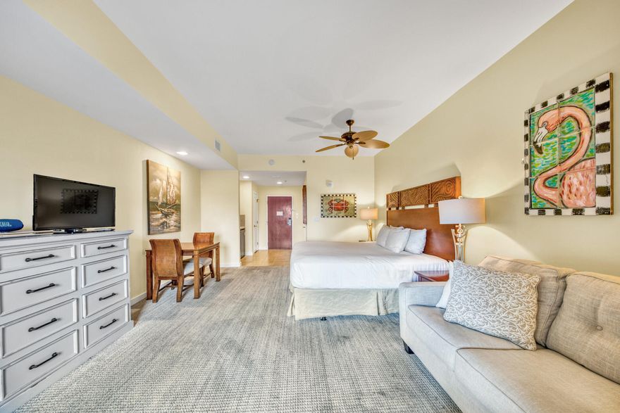 Luau II studio, beachside in Sandestin Resort. This 2nd floor condo is the largest studio floor plan (469 sqft).  Furnished beautifully (2019: new carpet, king-sized mattress, stylish sofa w/lounge seat, decor, lamps and dresser; Dining chairs re-upholstered.) Efficiency kitchen has mini-fridge, microwave, sink, coffee pot & toaster.  Only items not included belong to Rental Co (linens, towels, dishes, silverware, glasses) ~ A short stroll to the beach, enjoy all the resort offers including LUAU'S heated pool featuring a waterfall and walk under grotto passageway connecting the pool decks and the heated spa. Luau offers a fitness room, meeting room & laundry room. Owners have a Storage ''cage'' in Garage level.  Unit 6225 ALSO INCLUDES a 4-Seater GOLF CART [Batteries new Feb 2020]~