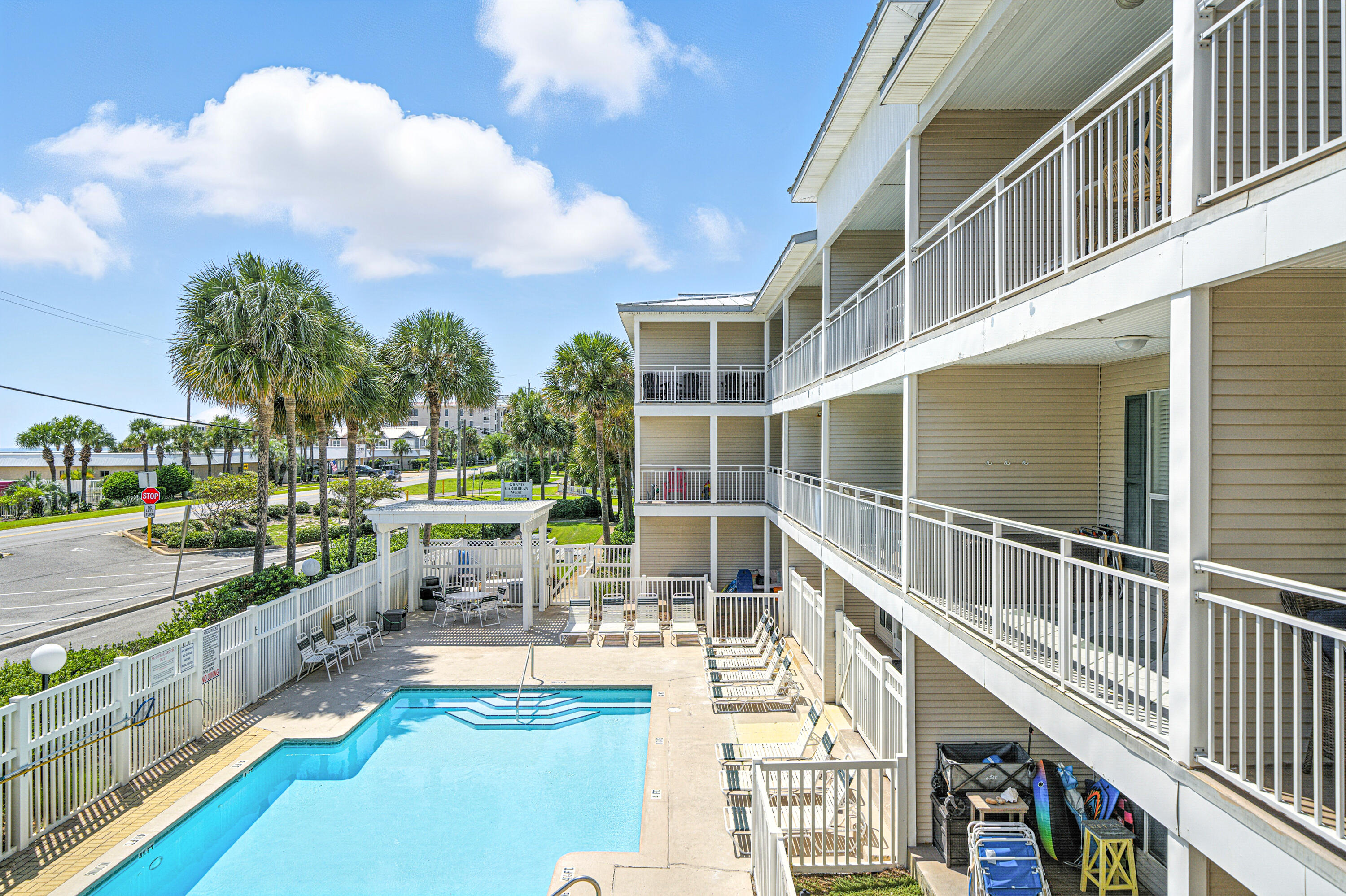 ***LOWEST PRICED CONDO IN THE BUILDING*** This perfectly located condo has 1 bed / 1 bath + hall bunks and is on the 2nd floor of this 3 story walk-up building across the street from a Public Beach Access to the Gulf of Mexico. This unit has an exceptionally large lanai shaped like an 'L' offering great views. Full size washer/dryer in unit. Sold completely furnished, including electronics, its ready to rent!! HOA fees cover everything except electricity and contents insurance condo. Contents insurance is approx. $2000 a year. There is plenty of parking, a large pool, hot tub, a grassy area for your pets and a BBQ grill and picnic table. The complex has passed its Milestone inspection, SIRS and has no foreseeable assessments. Look at 'Documents' tab for governing documents.