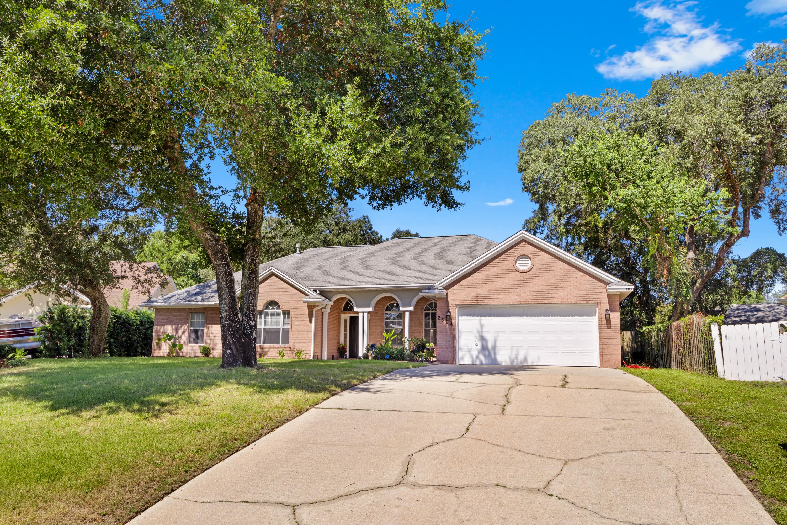 Welcome to 2809 Lee Trevino Ct in the highly sought-after Lake Pointe subdivision! This beautifully maintained 4-bedroom, 2.5-bath single-story home is move-in ready and offers a perfect blend of comfort, style, and function. Major updates bring peace of mind, including a new HVAC system (2022), LVP flooring in two bedrooms, and a lush Zoysia-sodded lawn within the last 3 years. Step inside to a spacious open living area featuring vaulted ceilings, abundant natural light, and a gas fireplace. The adjoining sunroom offers a flexible space ideal for a home office, reading nook, or play area. The kitchen is designed with both functionality and style in mind, boasting a gas stove, eat-in dining area, kitchen island with built-in storage, two pantry closets, and a built-in desk. Retreat to the primary suite with its elegant trey ceiling, expansive walk-in closet, jet tub, glass walk-in shower, and double vanity. Enjoy Florida living in the privacy-fenced backyard complete with an open patio and smart sprinkler system to keep your yard looking its best year-round. The epoxy-finished garage floor, large storage closet, and availability of fiber optic high-speed internet via Live Oak add even more appeal to this thoughtfully designed home. Don't miss your opportunity to own this gem in a quiet, well-established neighborhood just minutes from Eglin AFB, schools, and the beautiful Emerald Coast beaches. Schedule your private showing today!