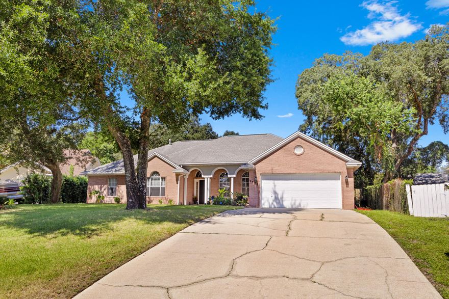 Welcome to 2809 Lee Trevino Ct in the highly sought-after Lake Pointe subdivision! This beautifully maintained 4-bedroom, 2.5-bath single-story home is move-in ready and offers a perfect blend of comfort, style, and function. Major updates bring peace of mind, including a new HVAC system (2022), LVP flooring in two bedrooms, and a lush Zoysia-sodded lawn within the last 3 years. Step inside to a spacious open living area featuring vaulted ceilings, abundant natural light, and a gas fireplace. The adjoining sunroom offers a flexible space ideal for a home office, reading nook, or play area. The kitchen is designed with both functionality and style in mind, boasting a gas stove, eat-in dining area, kitchen island with built-in storage, two pantry closets, and a built-in desk. Retreat to the primary suite with its elegant trey ceiling, expansive walk-in closet, jet tub, glass walk-in shower, and double vanity. Enjoy Florida living in the privacy-fenced backyard complete with an open patio and smart sprinkler system to keep your yard looking its best year-round. The epoxy-finished garage floor, large storage closet, and availability of fiber optic high-speed internet via Live Oak add even more appeal to this thoughtfully designed home. Don't miss your opportunity to own this gem in a quiet, well-established neighborhood just minutes from Eglin AFB, schools, and the beautiful Emerald Coast beaches. Schedule your private showing today!