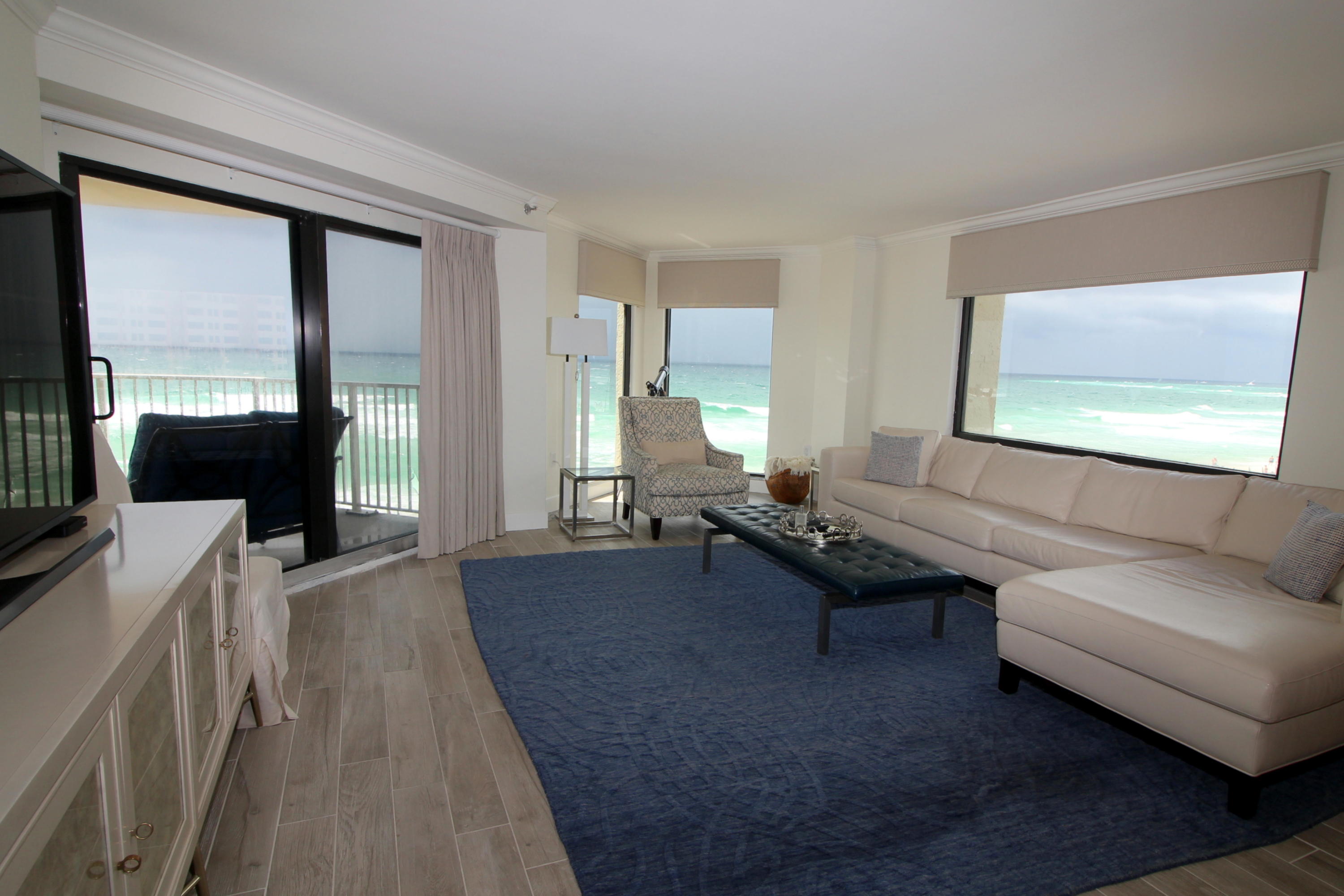This ''wiggle your toes'' in the sand rarely available premier corner unit offers magnificent views of our emerald green waters to the South & the West. Large picture windows allow views of the gulf from all the right places. The stunning decor in this unit is what every owner dreams about. Some of the many fine details include light gray plank tile in main areas,custom soft close cabinetry in the kitchen & baths with gorgeous white quartz counter tops with subtle hints of gray. Completely updated light and airy bathrooms are nothing short of perfection. Samsung Stainless Steel appliances, Hotpoint W/D, Huge TV's, gorgeous upscale patio furniture and so much more. Unit has never been rented. This would make a fabulous home or high-end rental. Turn-key Ready. Call me for details!