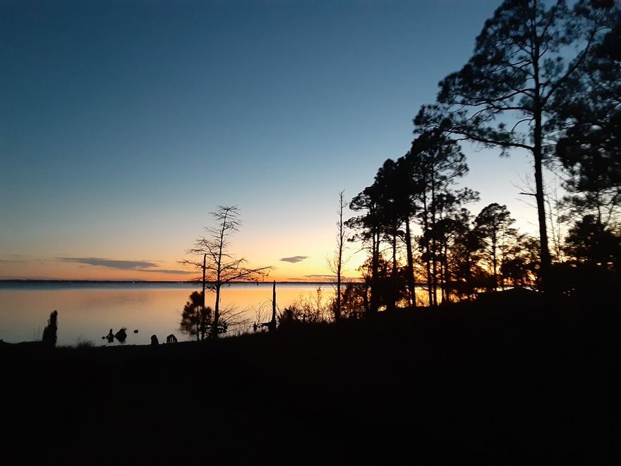Tucked away on Choctawhatchee Bay, this charming Florida cottage is a true private waterfront escape. With protected wetlands on one side and a wooded buffer on the other, your views and peaceful setting feel wonderfully secluded. Inside you'll find 1 bedroom (plus a flexible bonus sleeping space for guests). The star of the show? A 15' x 28' covered bayfront porch--the perfect spot for morning coffee, sunset dinners, and salty breezes. From your own shoreline, enjoy fishing, and watch bald eagles, dolphins, and marine life glide by. A special bayfront opportunity to enjoy now--while you plan your future dream home.
