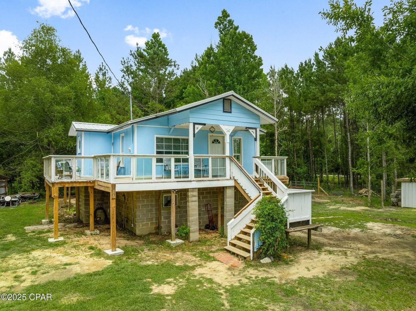 Newly remodeled and renovated homestead located on 1.064 acres with 3-bay pole barn, outbuilding, and fenced in equipment area under another smaller pole barn. This home has been completely remodeled to the studs. All new plumbing including water and sewage pipes, brand new kitchen with pantry and new appliances. The countertops are a showstopper, made of 3-inch hand-carved deadhead wood from the Apalachicola River. Brand new roof with updated wind mitigation report. Brand new 3.5-ton HVAC system. The crawl space underneath the home has brand new foam insulated floor joists. The new deck goes around 2/3rds of the home. Brand new CAT-5 hurricane resistant windows were installed. This home is meticulously maintained and pride of ownership is exhibited in every square inch of this home. The owner spent well over $100,000 bringing this property up to today's standards and the new owner will step into a home that is built solid with expert craftsmanship throughout.