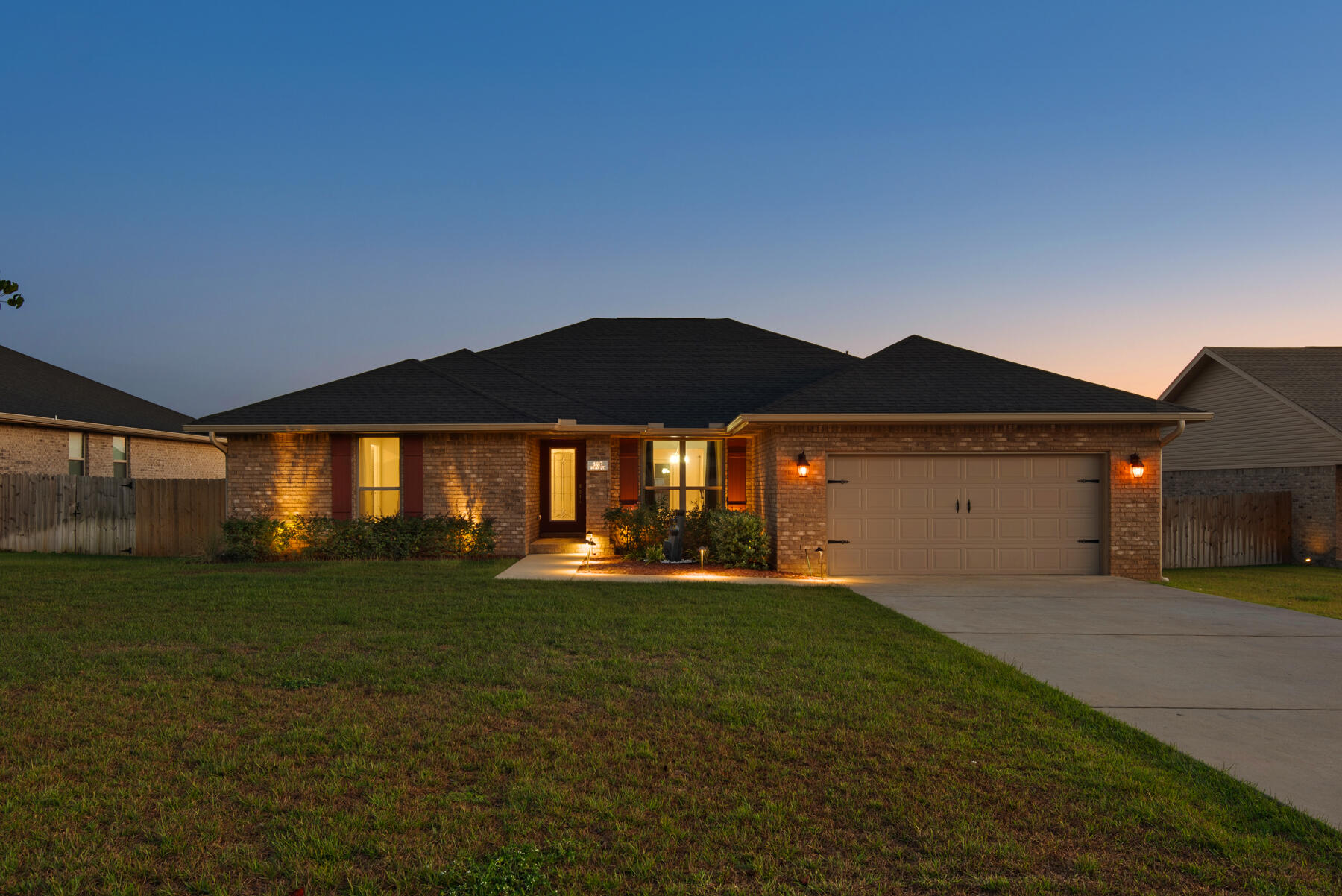 This Must-See beautiful brick home is a 2022 new build. 4- bedroom 3-bath home with a split floor plan. The spacious kitchen is perfect for entertaining, with an oversized granite island & butcher block countertop. The 2 car garage features epoxy flooring and is fully air conditioned. Relax on the back porch overlooking a beautifully landscaped backyard with picturesque lighting, complete with privacy fencing and a sprinkler system on a timer. Located in the coveted new subdivision of Charleston Place, in North Crestview, this home is in commuting distance to Eglin AFB & the best of FL beaches.