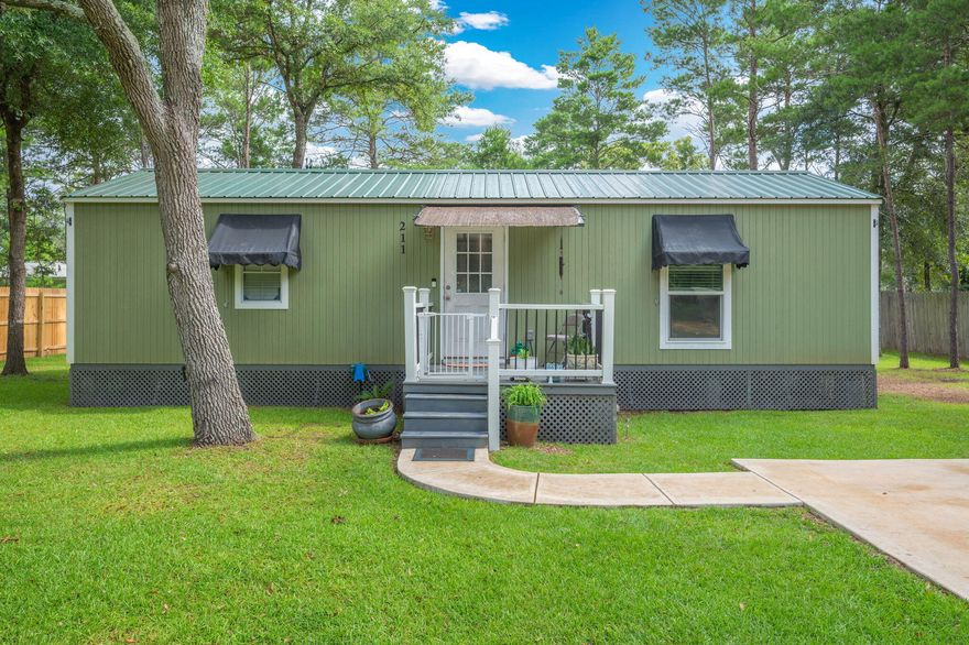 Small but mighty, this adorable 2 bedroom, 1 bathroom cottage is packed with personality and designed with serious attention to detail. Sitting pretty on a .23 of an acre fully sodded lot, this gem is move-in ready and waiting for someone who appreciates quality, comfort, and a bit of flair! Step inside to find vinyl plank flooring throughout, stainless steel appliances, and a tankless electric hot water heater. Enjoy central A/C & heat to keep you comfy all year long. Yes, the washer and dryer are included, because laundry day shouldn't be a chore. The covered front porch is perfect for sipping sweet tea, and the sliding glass door opens to a back porch ready for grillin' and chillin'. A double car concrete parking pad and walkway make coming home a breeze, while the Ring doorbell adds a smart touch of security. Whether you're starting out, downsizing, or looking for a weekend retreat...this cottage is cute, clever, and completely move-in ready.