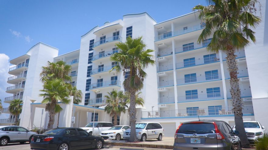 The best views for the best price! Harbor Lights is located on Holiday Isle which gives an optimal lifestyle for boaters and beach goers alike. The building boasts a modern / contemporary feel that is unlike any other structure in the area. With only 42 units, Harbor Lights allows the owners a great sense of privacy that is hard to find with other buildings located on the harbor. The two story lobby is fantastic; It consists of high speed glass elevators and two spiral staircases leading up to the owner's common area lounge. The lounge has many uses with a full kitchen, living room, library, pool table and balcony. The amenities of the building also include a lavish pool, gym and a common storage area for yolo boards. Unit 511 comes with a private garage, climate controlled storage room