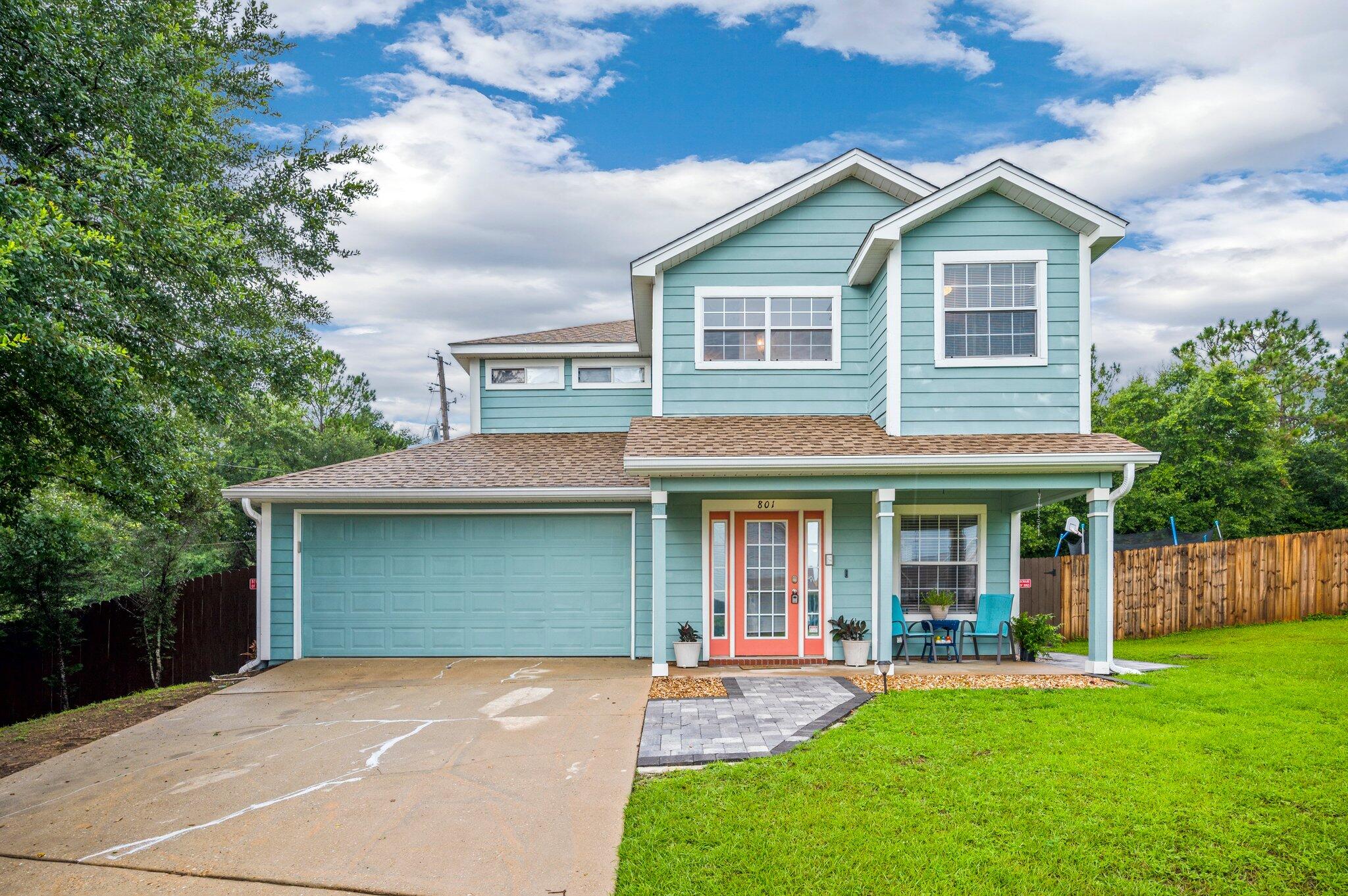 BACK ON MARKET due to Buyers financing!!! Located in south Crestview's Sandy Ridge neighborhood, this beautiful 3 bedroom, 2.5 bathroom home is full of personality! As you enter the home, you see a large living area with all new flooring. The kitchen features stainless appliances, tile floors, a beautiful breakfast bar, and a quaint dining area with a view of the backyard. The backyard features a beautiful patio area consisting of pavers and a built in fire pit, perfect for hosting all year long. In the master bathroom, you will find a large soaking tub and double vanity sinks and tile floors. Roof less than a year old! This beautiful home will not last long!