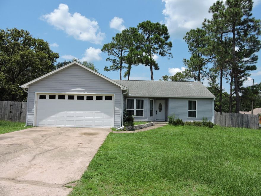 Located South of I-10, this freshly painted 3 bedroom, 2 bath, 2 car garage home situated on a corner lot with large fenced in backyard. The home features large family room with cathedral ceilings, dining area with a bay window offering plenty of natural light.  The home features split bedroom design with large master suite.  The additional bedrooms area nice sized with ample closet space.  The large 2 tier deck off the the back of the property is perfect for entertaining.  Schedule your private showing today!