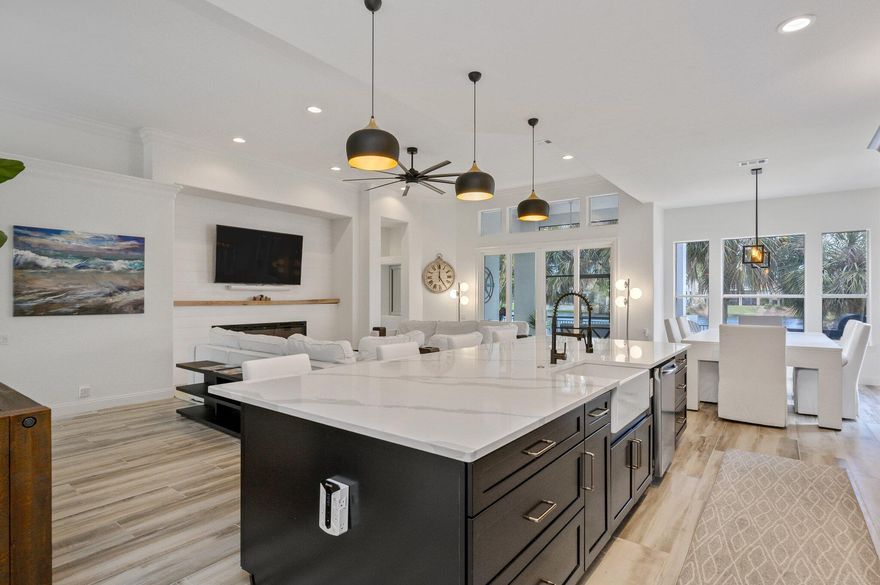 Priced-to-sell! Unrivaled quality! Amazing 3 Bedroom/3.5 Bath Waterfront One-Level Living in Regatta Bay: Nestled within the prestigious golf club community, this premier residence is elegantly remodeled and impeccably designed, graciously overlooking a picturesque lake. Indulge your culinary passions in the state-of-the-art, modern chef's kitchen, adorned with a mesmerizingly gorgeous backsplash. Equipped with professional-grade appliances and featuring a magnificent farmhouse sink, the kitchen becomes a culinary haven fit for the most discerning of chefs. Entertaining is elevated to an art form with the tremendous oversized island overlooking the living area with 72' electric fireplace and custom mantle! Boasting an impressive 60 feet of waterfront, the setting is serene and relaxing!