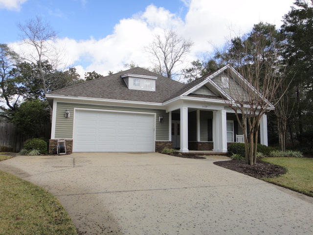 OMGosh what a super cute house! This 3 bedroom 2 bath house is a must see! This Craftsman style house built by Randy Wise has a fabulous floor plan and many marvelous touches. The spacious foyer is reminiscent of low country homes and carefree times! Just off the foyer are two good sized bedrooms and a hall bath. Stroll down the foyer a bit more and you will find the office. French doors keep the office contained and the built-in desk and cabinets keep office supplies corralled. Just past the office is the heart of the home. The open kitchen/family room concept is perfect for entertaining. The kitchen has white cabinets, a large island - ideal for buffets or overflow seating, and a ton of countertop space! The breakfast area has French doors that lead to a covered porch that