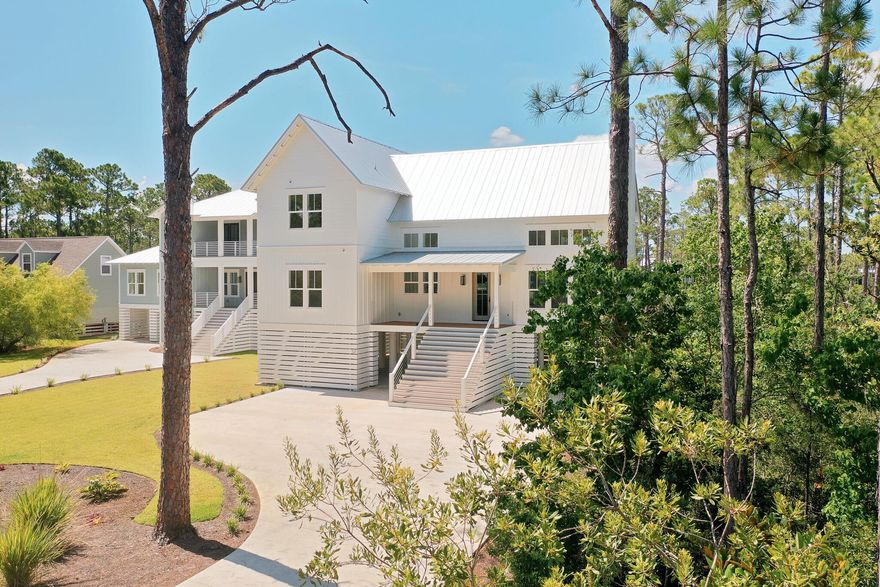 Discover waterfront living at its finest with this stunning new construction home nestled on a generous lot featuring a private dock and boat lift. This exceptional home combines elegant coastal design with modern functionality and breathtaking views.Step inside to a grand entry that immediately impresses with soaring cathedral ceilings, custom chandeliers, and expansive windows that flood the space with natural light. The open-concept layout seamlessly connects the living area to the kitchen, centered around a sleek electric fireplace and designed to maximize both comfort and style. The heart of the home is the chef's kitchen, featuring a large island with a waterfall-edge quartz countertop, a six-burner gas stove with custom wood range hood, stainless steel appliances, and neutral wood finishes and flooring carried throughout the home. A cozy dining area sits just off the kitchen, offering uninterrupted views of the water.

Extend your entertaining outdoors and catch a salty breeze on the covered balcony with beautifully detailed wood ceilings and modern cable railings that ensure the view remains the focal point.

The main-level primary suite is a true retreat with serene water views from the moment you arise from your bed and a luxurious ensuite bath that includes dual vanities, a walk-in glass-enclosed shower, custom lighting, and a deep soaking tub that elegantly separates the vanity spaces. A spacious walk-in closet with custom wood shelving completes the suite.

In addition, the main level is a secondary bedroom with its own ensuite featuring a tub plus shower combo-perfect for guests.

Upstairs, you'll find two additional guest bedrooms, each with private ensuites, as well as a flexible bonus room ideal for a home office or study, complete with its own half bath.

The expansive lot offers limitless possibilities-whether you envision adding a pool, putting green, or creating your own outdoor oasis, the space is there to make it a reality. Ideally located just minutes from iconic 30A and only 10 minutes to Sandestin, you'll enjoy easy access to local shops, acclaimed restaurants, year-round festivals, and the sugar-white sands of the Gulf. Spend your days boating right from your backyard into the Bayou and Bay or unwind with a sunset cruise after a day at work-this is coastal living at its best.