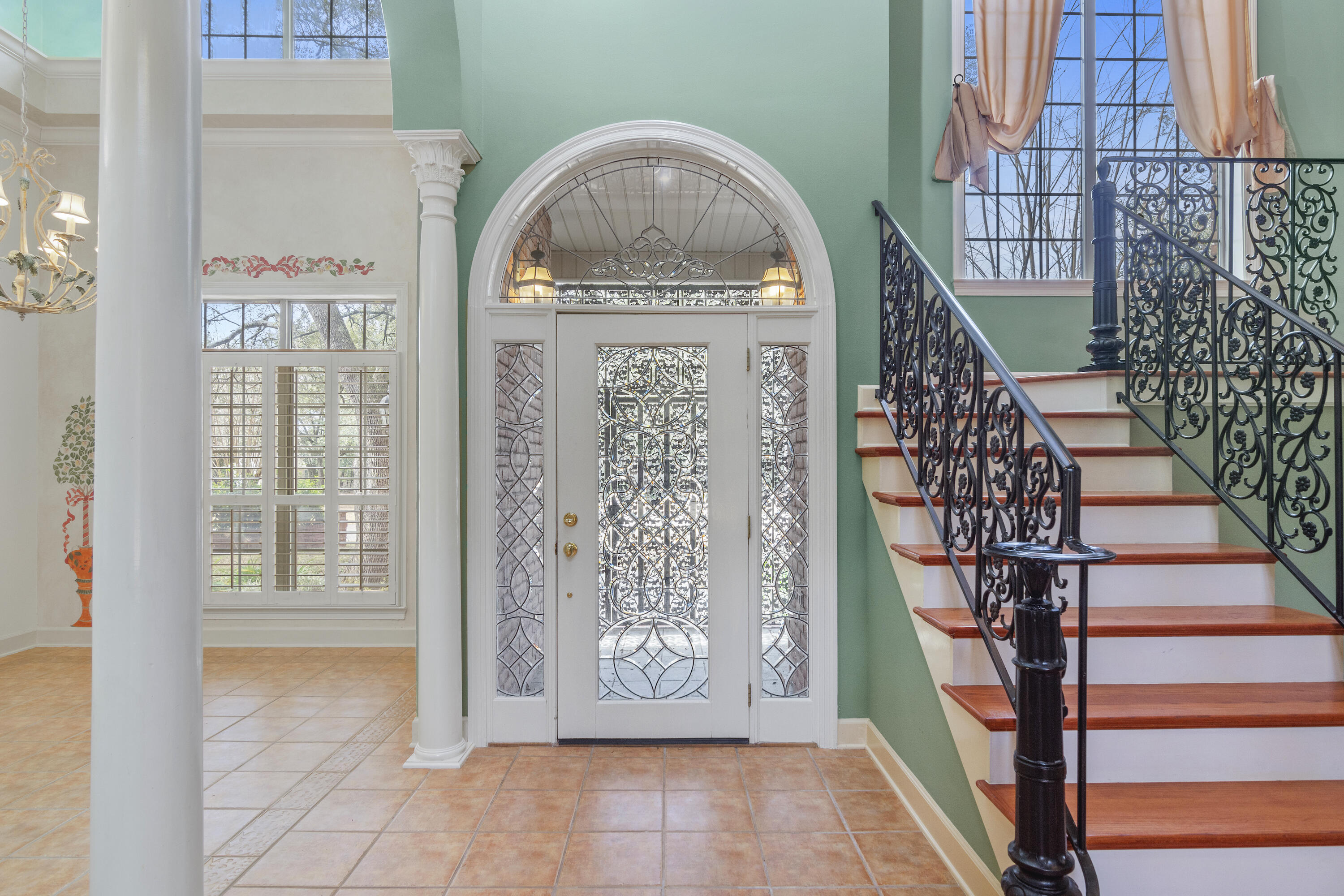 Prestige and value! Come home to Old South Dr! This exclusive neighborhood features upscale homes in North West Crestview. This custom home is an exclusive design with extras that are a must see! The two story design and the massive live oak trees draw you through the brick lamp post entry to the leaded glass front door. As you enter, the wrought iron hardwood staircase leads your eyes across the landing to the balcony over looking the living room. You feel majestic in the presence of the many columns , high ceilings, and natural light from the gigantic windows. All the bed rooms have their own full bath . The master bath's jacuzzie tub will wash away the day in lilac and lavender. An additional bed room has an extra large closet , built in desk and book case, window seat and