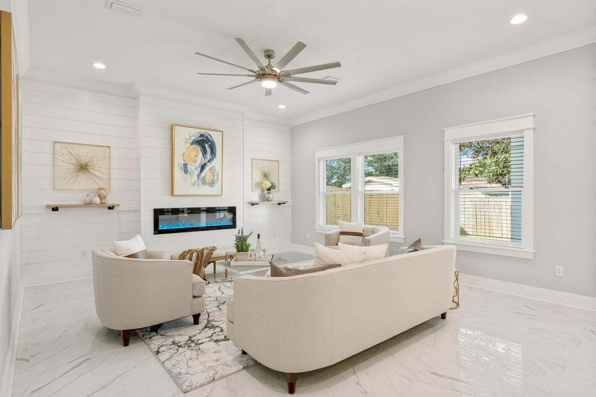 Indulge in luxury with this new 2-story home - 4 beds, 3 baths, 9'-10' ceilings. Revel in opulence with marble-look floors, brushed nickel hardware, crown molding, tray ceilings, wainscoting, and 2500 sqft of a breathtaking floor plan. Gourmet kitchen includes: quartz countertops, shaker-style cabinets, T-shaped island, Samsung stainless steel appliances. Living room with shiplap accent wall, electric fireplace. First-floor bedroom/office. Upstairs: 2 bedrooms, full bath, dream Master Retreat and Ensuite with large windows, tray ceilings, spa-like bathroom. Fully fenced backyard, landscaping, sprinkler system. 1-year builder warranty, no HOA, half a mile from Public Beach Access. This one-of-a-kind masterpiece won't be available for long. Schedule your exclusive showing today!