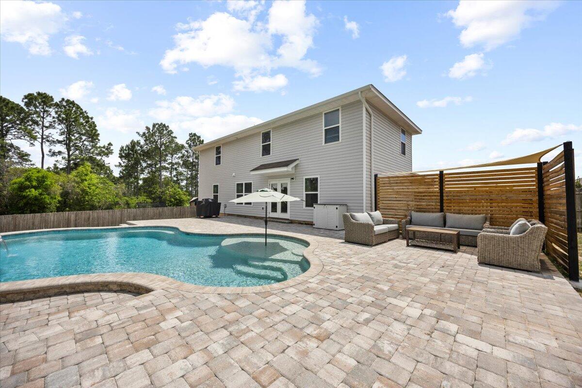 Price reduction!! 1 year home warranty included. This spacious open floorplan 5-bedroom, 2.5-bathroom beauty offers 2596 sq.ft of luxurious living space and is designed to impress. The expansive backyard includes a sparkling 32ft Gunite custom pool with a waterfall feature, tanning ledge, built in seats, color changing lights, surrounded by gorgeous pavers. Perfect for hot summer days and outdoor entertaining. Plus, with no backyard neighbors, you'll enjoy the privacy from the surrounding wooded area. The heart of the home is the large kitchen with ample cabinet storage space and granite countertops, stainless steel appliances, a large island and eat-in dining area. The main level features a luxurious master suite complete with a huge walk-in closet and 5 piece en-suite bath. Upstairs, enjoy a spacious bonus area, ideal for a media room, playroom, or home office, four generously sized bedrooms.
Additional highlights include beautiful custom shiplap accents in the living area, LVP floors on the entire main floor-even the master bedroom, a two-car garage and it's located south of I-10.
This home truly has it all, schedule your showing today and see for yourself!