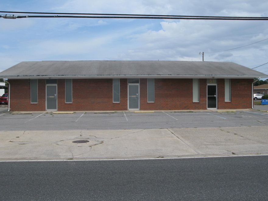 Nice Office or Retail building with 3 separate units located next to Gatlin Lumber. Presently a doorway opening between the units and used as one space. Can be owner occupied and use all of building or a portion and rent out the balance. Ideal investor property with potential rent income possibly over $27,000 per year based on $10 sqft asking rents. Entire property is paved and rear of property fenced in.