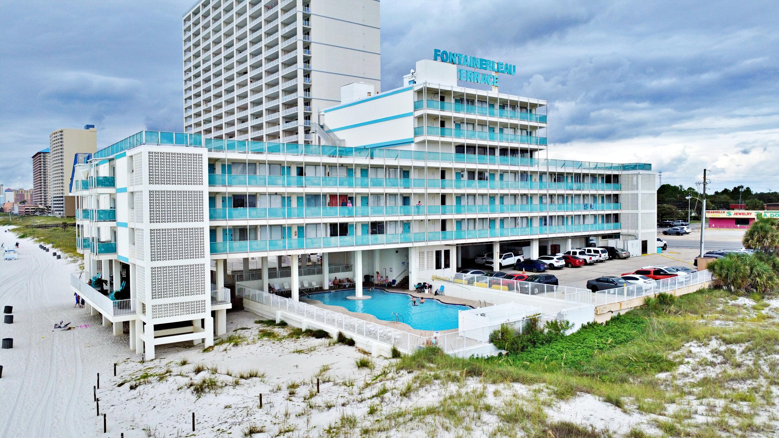 Charming fully furnished beachfront studio featuring sweeping water views facing east toward the open beaches of Bid-a-Wee. Recently renovated with laminate flooring, modern fixtures, and stylish furnishings--ready for immediate occupancy or short-term rental start-up. Situated on the 4th floor with convenient access via stairs or elevator. The community offers an updated pool, spacious decks for sunset views, an owner's lounge, fitness room, and outdoor barbecue area--popular amenities in a classic 1965-built complex.Value-conscious pricing in today's market--especially notable while special assessments are in place--makes this a rare Gulf-front opportunity. This unit offers excellent potential as a vacation retreat or investment property. Sellers encourage offers; schedule your showing today!
