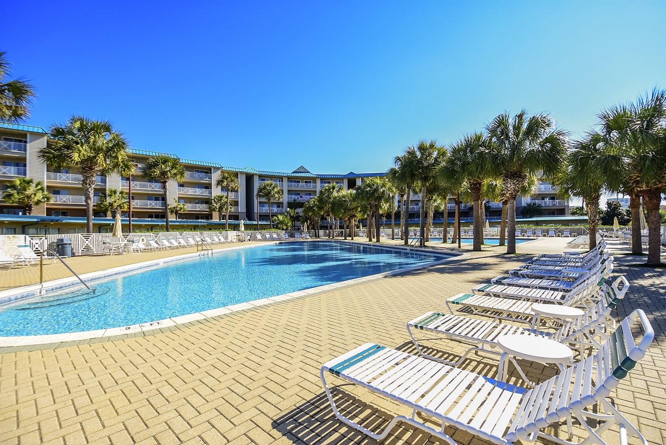 MOTIVATED SELLER! Bring offer! Amalfi Coast Resort is a gated complex situated on 8.6 acres of luscious, beautifully manicured grounds. Amenities include two lighted tennis courts, two pools (one heated), outdoor grilling and picnic areas, fitness center, and over 360 feet of deeded beach access! This 2-bedroom, 2-bath END UNIT comes with a deeded garage parking space and interior locked storage closet. Amalfi is a concrete and steel constructed complex located near the famous Silver Sands Outlet Mall, close to grocery stores and many restaurants. HOA fees include water/trash/cable/internet/pest treatment, exterior maintenance, exterior insurance, Association management, and recreational facilities. Come enjoy all that Amalfi has to offer!