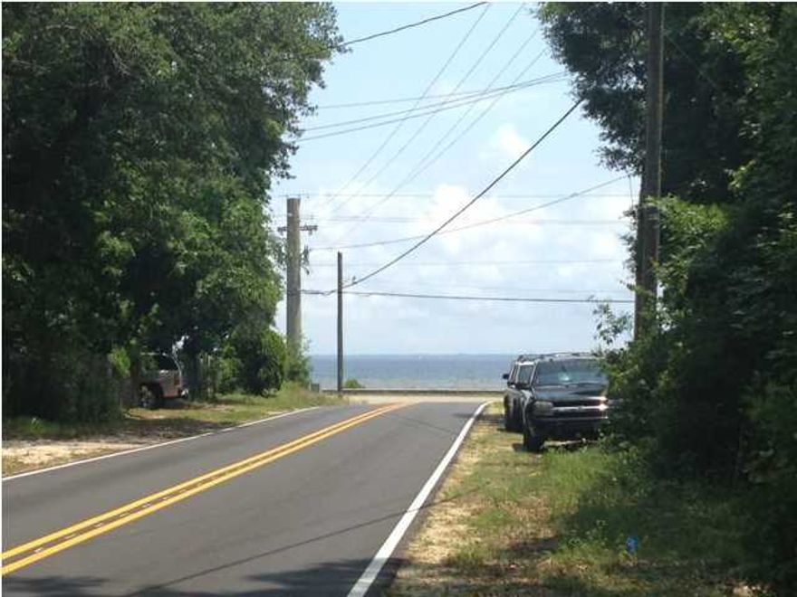 LARGE LOT WITH POTENTIAL BAY VIEWS! Located just two lots back from Choctawatchee Bay, this large, .57 acre lot may deliver Bay views from the 2nd or 3rd story. Moreover, there's no waiting or delaying. Since this lot is not a short sale, it is available NOW. Camper currently on lot will be moved and large garage is negotiable. Take a look today. There's never been a better time to purchase a lot for your dream home than now.