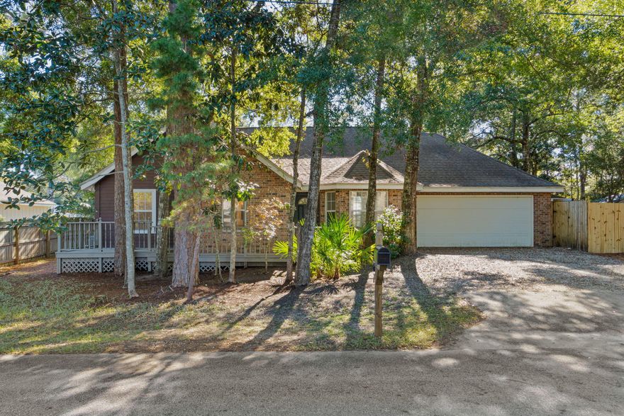 Unique Waterfront home on one of the few Canals in the area with Bay access. This 3BR/2BA residence includes a spacious all-brick Guest house with bath & plumbing for a future kitchen - ideal for an in-law suite, office, gym or flex space. Enjoy exceptional outdoor living with a private rear Courtyard bordered by the canal, brick fencing, Guest house, plus multiple entertaining areas: screened porch with bar, jasmine-covered trellis over patio, upper Canal-view deck & lower deck/dock for water sports. Ample parking with 2 car garage, driveway & potential side parking. Located on a quiet street of only 12 homes with green space across the street. No HOA. Less than 2 miles to Grand Blvd, Publix, Hospital, Grand Blvd dining & just a few more miles to the Beach. Rare opportunity - won't last!