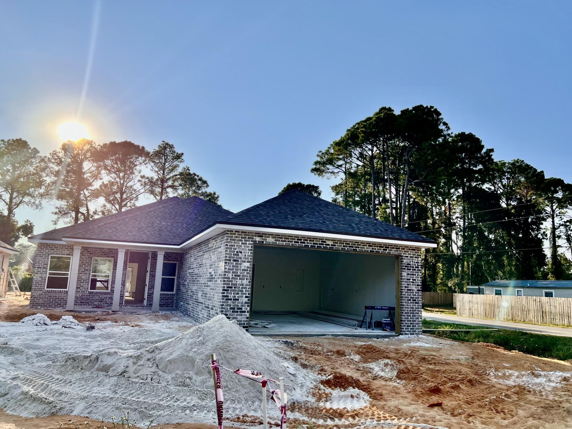 This Beautiful 4 bedroom, 2 bath all brick home sitting on a corner lot is located at the East end of Niceville. The seller pays 10,000 towards the buyer's closing cost & more. This all brick home sits on a corner lot with no HOA fees. You'll absolutely LOVE this OPEN floor plan featuring 9ft. ceilings throughout and 10ft where reverse trey ceilings are located. This home boast many custom amenities. 8ft front and garage door, extra parking pad for a boat or RV. The kitchen is divine, featuring white custom cabinets, soft close drawers, farm sink, pantry, undermount lighting under cabinets and quartz countertops throughout. The island bar has an 18 inch over hang, a reverse trey ceiling in the family room with changeable lighting for seasonal events. Enjoy the floor plug added to the family room for phone chargers and lamps without cords hindering walkways. Love entertaining? The kitchen and family room open up to a screened porch with an extra concrete pad for grilling and an extra patio set. The master bedroom has a trey ceiling with recess lighting and opens to a custom master bath. You'll absolutely love everything about this bathroom! It's wonderful for relaxing, with endless hot water with it's tankless hot water heater and the deep soaker tub. The master shower, boast custom tile with a rainhead, and 2 other separate sprayers, bench for sitting while shaving and seamless glass. You will actually want to do the laundry, with a custom folding table with quartz countertop, hanging bar and custom designer hooks attached. When you want to relax and rewind, the back yard is the place. You'll enjoy a fully sodded yard, full gutters, sprinkler system, and a 6 ft. privacy fence, making up-keep easy. This home has everything and sits on a corner lot. Theres an alley road for these homes that give an entrance to the back yard as well. For energy efficiency the builder has installed upgraded spray foam in the roof. You will also enjoy the storage above the garage. The whole family will love the location!
Your close to restaurants, a large park with boat launch and Eglin Air Force Base, Special Forces, Emerald Coast beaches, shopping, hospitals and more. Call today for a viewing, this won't last long! Home will be completed October 21, 2025.