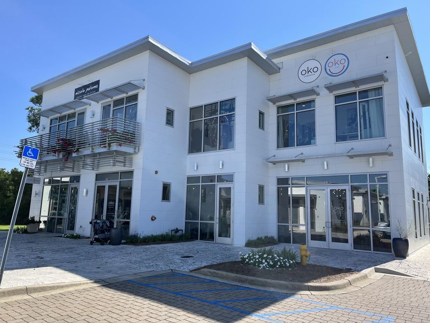 Large second-floor office/studio space available at 35 Hub Lane at Shops at The Hub. The space is approximately 1200 square feet and has luxury vinyl plank flooring, access to bathrooms, and private rear staircase. The space has an abundance of natural light and backs up to the preserve for added privacy. This space is best suited for a destination business, office space, or studio since it won't have a high level of foot traffic. Utilities included.