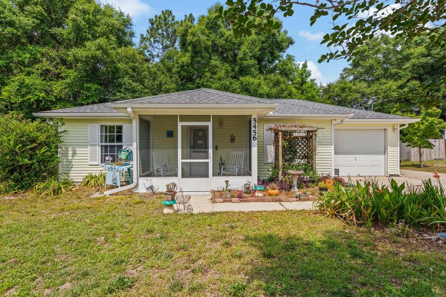 Welcome home to 5456 Haburn Street Crestview Fl! You will enjoy this peaceful sanctuary close to all the conveniences of Crestview and close to I-10. This home has been meticulously well maintained and is on a quiet street with large private lot. Pride of ownership is apparent with this lovely 2 bedroom, 2 bath home with 1 car garage. Enter through your enclosed front porch to your living room into your peaceful retreat, ample storage, laundry and one of two large bedrooms, all closets offer wire built-ins. Your master bedroom and en-suite includes a whirlpool tub and walk-in shower. Both bathrooms have tiled flooring. Enjoy making dinner in your cozy kitchen with its beautiful tile floors and oak cabinets then pass through your dining area that also has... a tiled floor, with custom built-in office/craft area to relax on your picturesque screened-in back patio as the tranquility of the backyard surrounds you. Additional out building with existing electrical provides a perfect space for extra storage or room for your hobbies, tools or gardening equipment to play in the extraordinary gardens in your naturally landscaped back yard. Owner has extended the driveway along the garage to the back yard. Perfect to park your RV, boat or toys. Roof replace 2022. HVAC 2019. Buyer to verify all square footage.