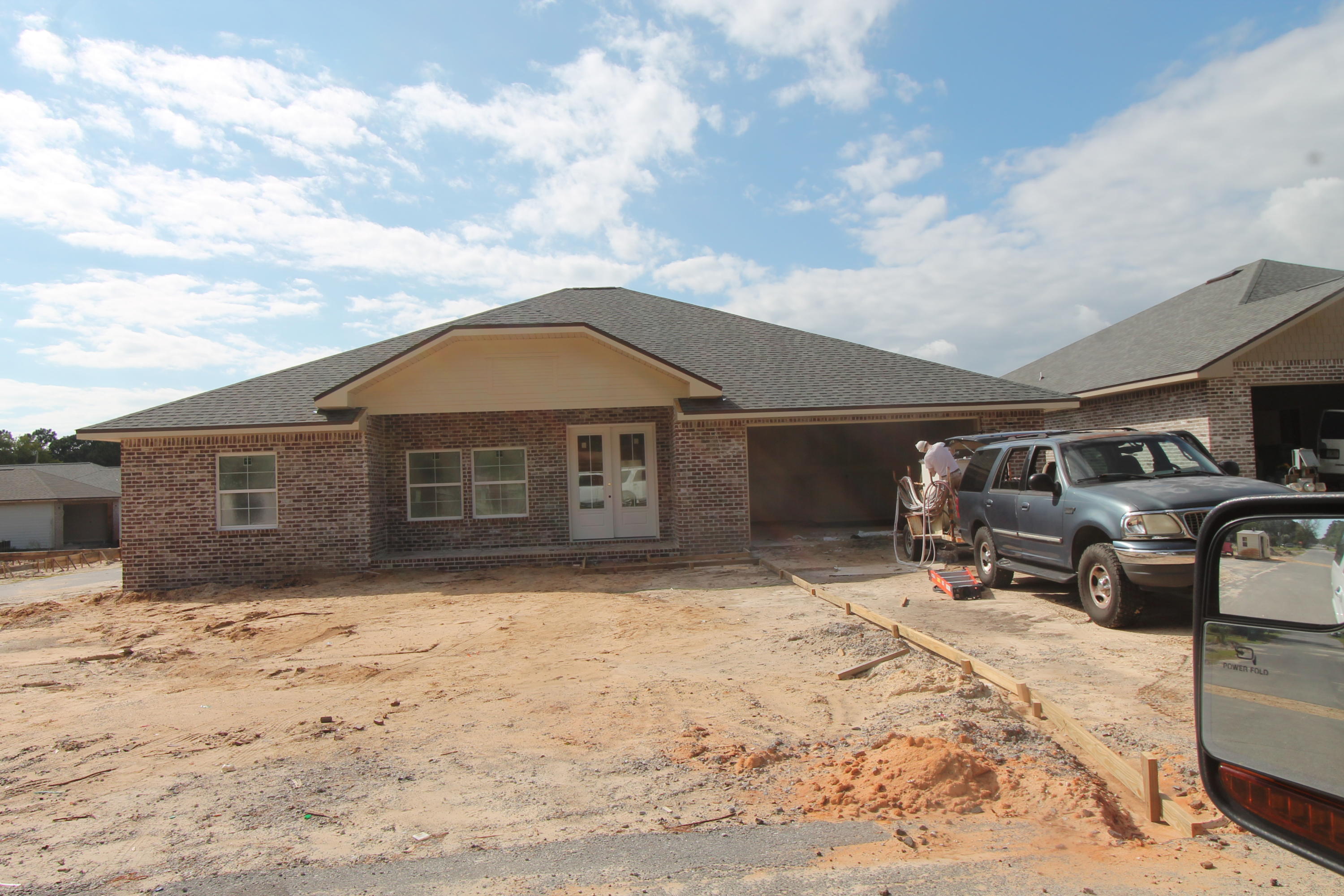 Welcome to Temple Park, a 40 lot development is Shalimar with both underground utilities and sidewalks. This 4/3 custom brick home has super curb appeal. There are 10 Ft. ceilings w/ impressive crown molding, LVP flooring throughout the main living areas, tile in baths, and 5 1/4'' baseboard throughout. As you enter the home through the covered front porch, the formal dining room is on your left. As you continue down the hallway, you will then enter the chef's delight kitchen which boasts custom painted Ivory cabinetry, granite countertops, a large pantry, and stainless appliances (including an oversized commercial grade refrigerator/ freezer).