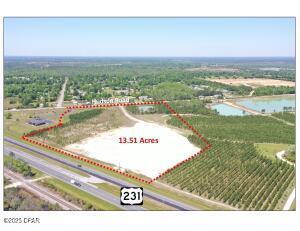 13.5 acres zoned General Commercial (GC-3) in unincorporated Bay County. The site was cleared and filled, which is a massive expense in today's market. The site is ideal for many commercial uses. The median-cut on U.S. Highway 231 is centered on the 13.5 acre parcel. 1,087 feet of frontage on U.S. Highway 231. 763 feet of frontage on Hudson Road. The seller will consider leasing or selling the adjacent office building and property to the south. The 4,624 square foot office building is in pristine condition with superior construction on 2.91 acres. Please call listing agent for showing information. The survey is attached. Call for details and to setup a tour of the property.
