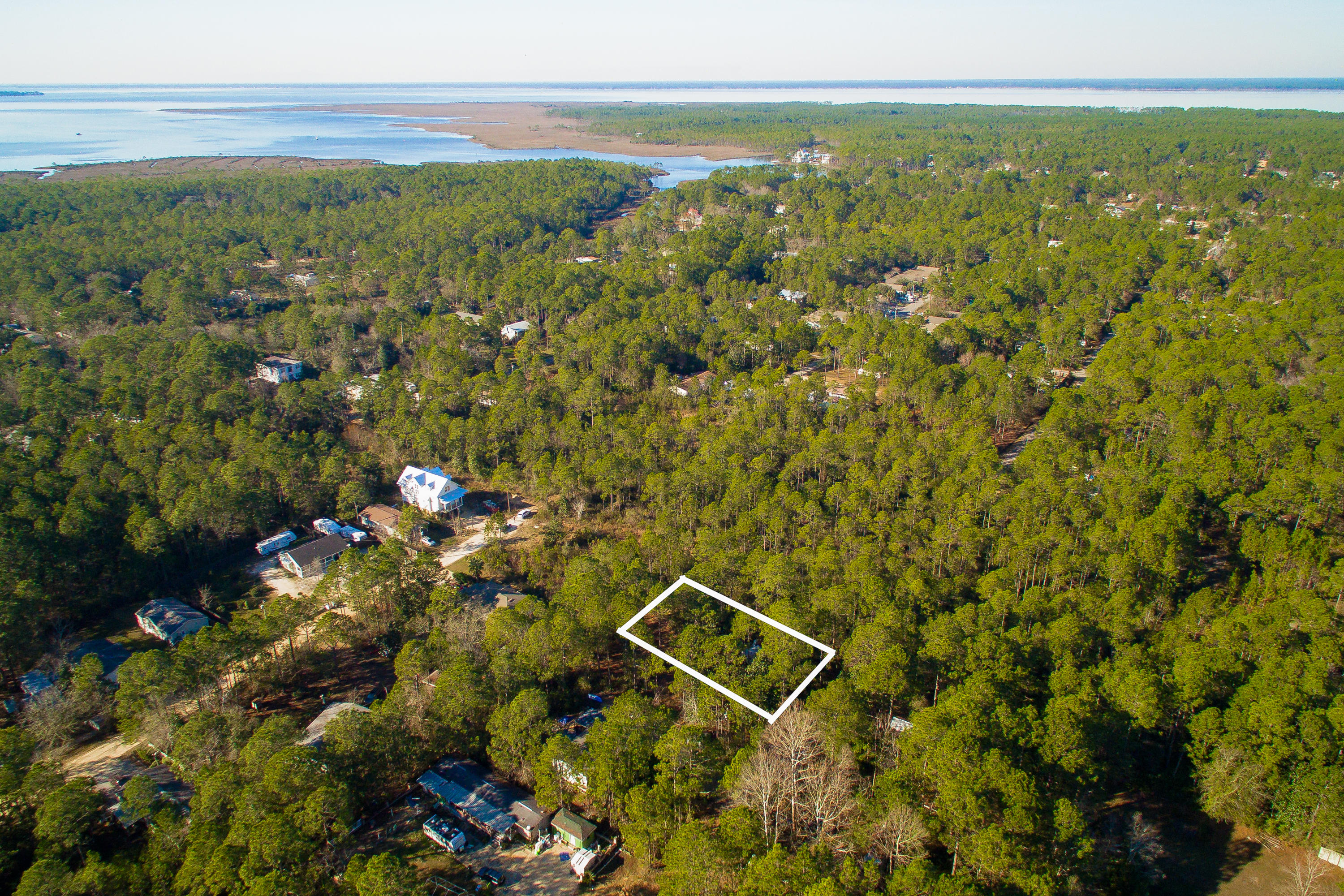 Under contract with a ''first right of refusal'' clause with a timeframe of seventy-two (72) hours.Hop on North County Highway 393 and drive straight as a pencil for a mile and a half, and you will be looking to the horizon over the pearl white sandy beach and emerald green waters of the Gulf of Mexico. Reverse direction and come home to the little bungalow you have always dreamed of and designed in your mind. Towering trees on this special lot offer an element of privacy. Discover where the sun rises and sets, so you can orient your building site to capture natural light streaming in windows. If boating is your passion, bay access is near. Choosing to build in Santa Rosa Beach comes with many benefits along this 26-mile stretch of the Emerald Coast. Dining, shopping, beach