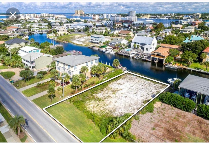 ACCEPTING BACKUP OFFERS!!! DEEP WATERFRONT canal LARGE home site lot across the street from GULF. Possible GULF VIEWS.