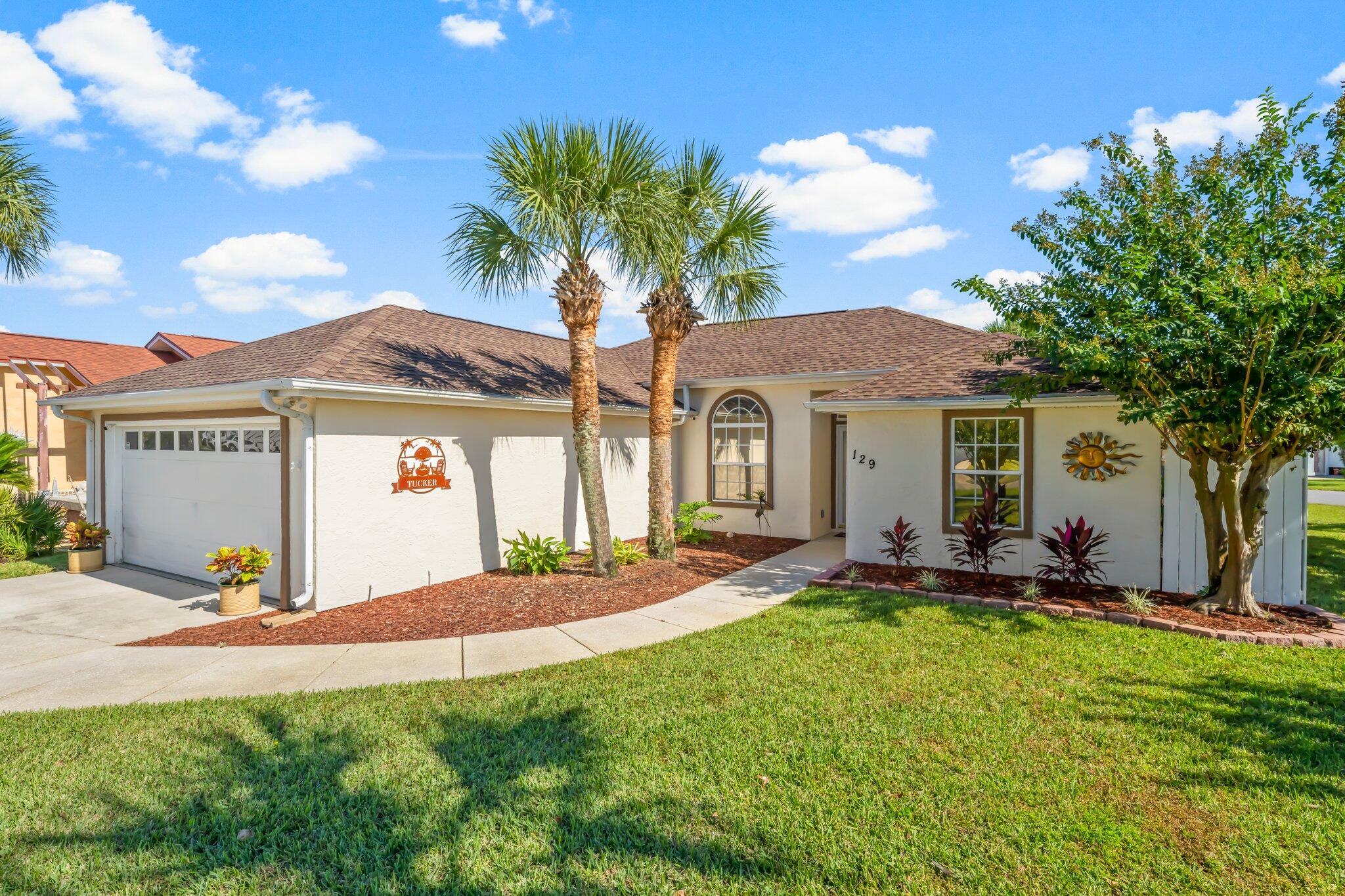 Stunning, completely remodeled 3 bedroom, 2 bathroom home located on a corner lot in Seaclusion Beach, adjacent to Bid-a-wee. New LVP flooring, new interior paint, new exterior paint, all new landscaping, new quartz countertops, seaglass backsplash, new cabinets, new fixtures, and LVP was put all the way in the closed patio. Roof is 2019. This home is located a short walk and golf cart ride to Bid-a-wee's coveted private beach. Walk to the beach, golf cart friendly, over 2300 feet of dedicated and unobstructed beach with 5 exclusive/gated beach accesses. All new landscaping, brick paver patio and sunroom with room for a gas grill. The home features a large living area, open floor plan with kitchen/dining blending into the living area. This home is a split floor plan with the master bedroom on one side and the two guest bedrooms on the opposite side. It offers a quaint and cozy enclosed back porch, surrounded by an open patio for sunbathing and fenced in for plenty of privacy. Other features include a new roof in 2019, lawn sprinkler system with separate well, new window treatment throughout, and recently painted exterior stucco finish.