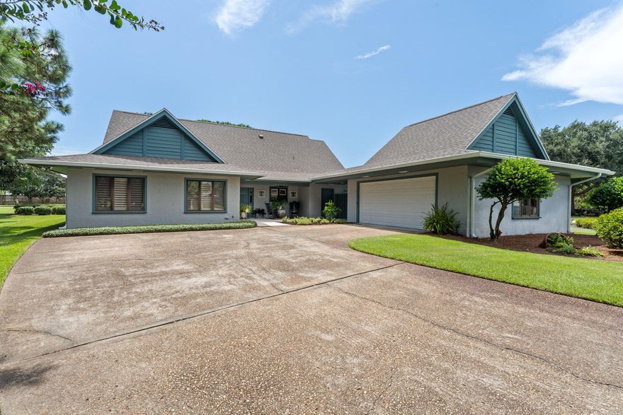 Quiet and private, Golfview is a non-rental community with mostly full-time residents. Enter this home and be dazzled by the cathedral ceilings in the living and dining room that create a wonderful visual first impression. A wood burning fireplace anchors both rooms. Home has wood plantation shutters, screened-in side/back porch, aluminum hurricane shutters along back of house and a newly installed Trex deck that spans the entire length of the house. Huge garage large enough for work shop, golf cart and two full-size cars. This home has great bones and amazing potential and is waiting for just the right person!! All fees and room dimensions must be verified by the buyer.