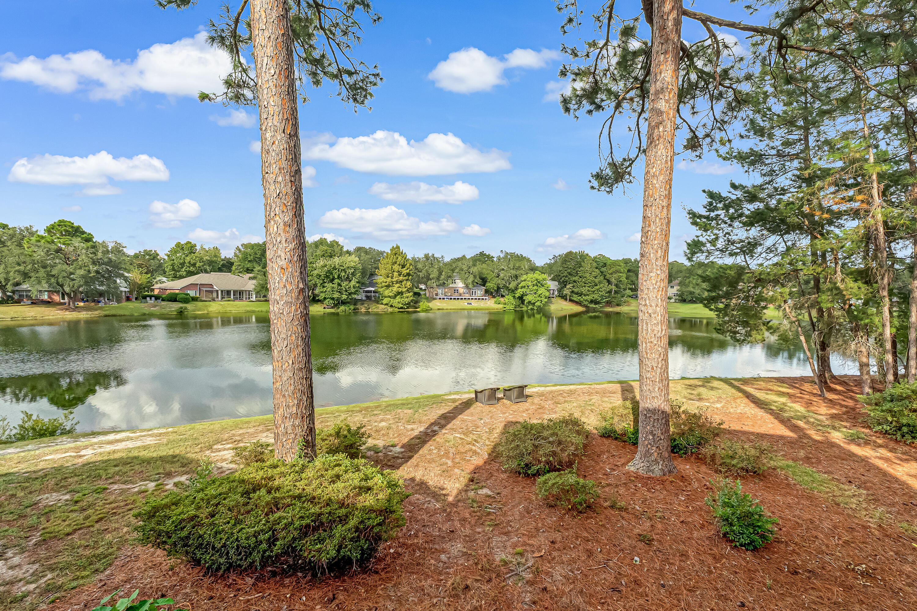 Welcome to this spacious second-floor condo nestled in the heart of Bluewater Bay! Featuring three bedrooms and two full baths, this inviting home offers a serene setting with beautiful lake views and abundant natural light throughout.The kitchen is equipped with stainless steel appliances and a stackable washer and dryer for convenience. Enjoy the comfort of plush carpeting, ceiling fans, and an open living area that flows seamlessly to a covered patio with three sliding glass doors--perfect for relaxing or entertaining.The large primary suite includes a generous vanity area, dual sinks, and a tub/shower combo. A versatile office or flex space adds functionality with its ceiling fan and skylight, creating a bright and airy work-from-home environment.With ample storage and access to Bluewater Bay's amenities including walking trails and a marina, this condo offers the perfect blend of comfort, convenience, and coastal living.