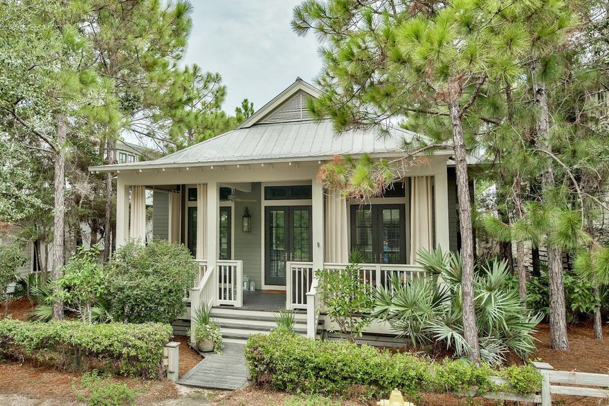 Located in the Camp District of WaterColor Phase II. This 3 Bedroom, hall bunks, teen suite loft and 3 Bathroom home is ready for your enjoyment, a rental property investment or both! Offered beautifully furnished and move in ready, the front porch welcomes you with gas lanterns, swinging bed and sitting area. Stunning reclaimed antique pine floors give way to an open floor plan, vaulted ceilings and wood planked walls. The home, built by Chris Clark, with custom cabinets, two fireplaces, large kitchen island & pantry leave room for everything and space for everyone. The back screened in porch leads to you the grilling area, outdoor shower and parking for 2. Steps to Camp WaterColor and close to Publix. The WaterColor Amenity Expansion Project special assessment has been paid in full